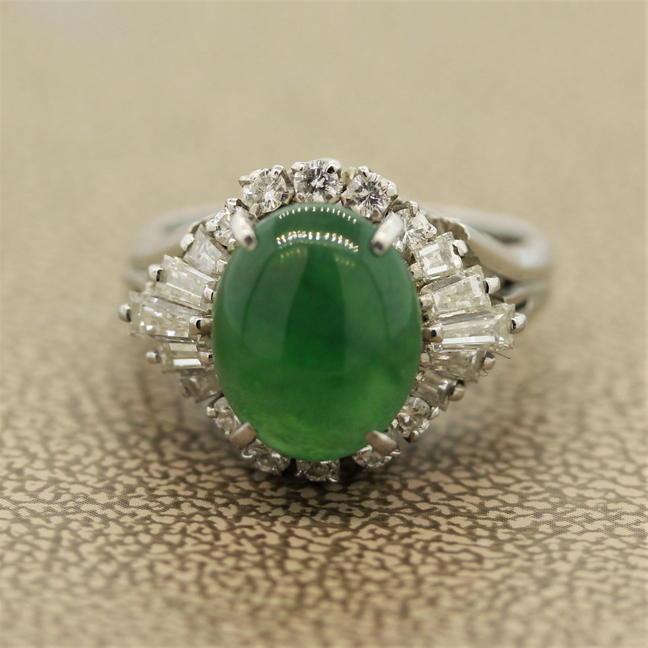 A natural Jadeite Jade ring set in a hand fabricated platinum mounting. The jade weighs approximately 3 carats and has a bright apple green color that is semi-translucent which makes the stone appear to glow. It is accented by 0.80 carats of round