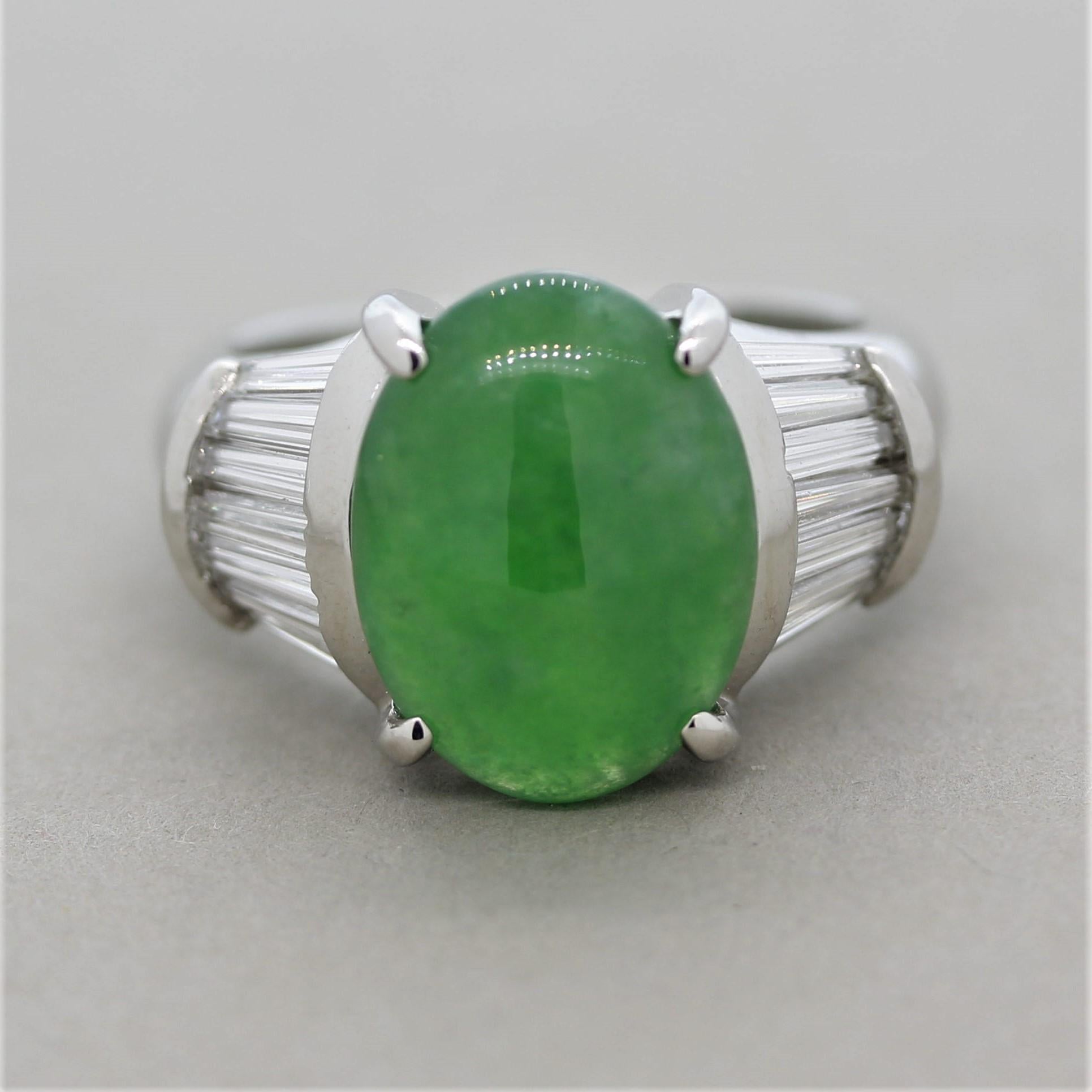 A lovely and well-made natural jadeite jade ring! The jade weighs 4.97 carats and has a luscious green color seen in finer pieces of jade. It is semi-translucent as it appears as light is glowing from the interior of the stone. It is accented by