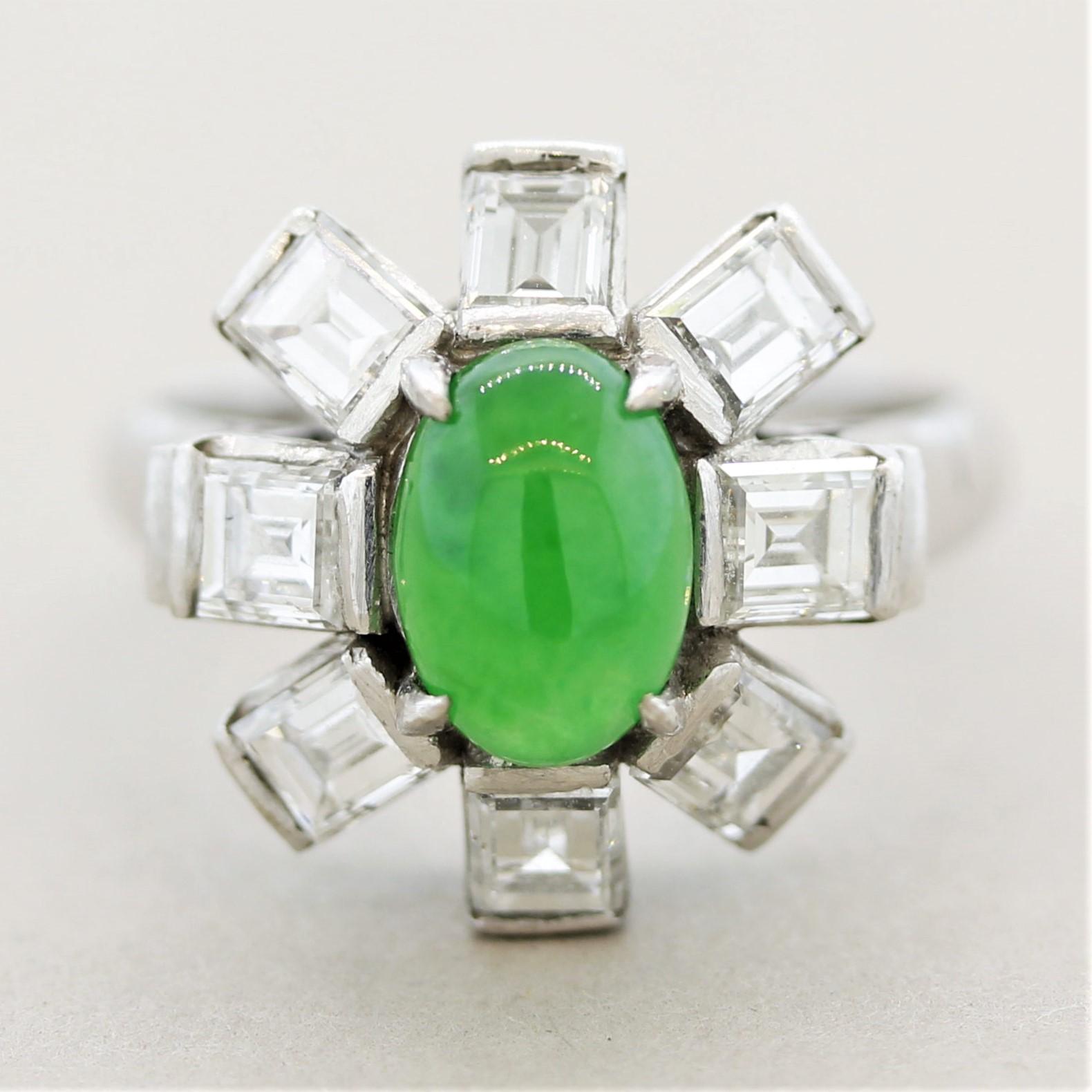 A superb ring in terms of the quality of the gems used as well as the design and setting. It features a luscious bright green natural jadeite jade which has excellent luster as light appears to roll off the stones surface. It is accented by 1.70