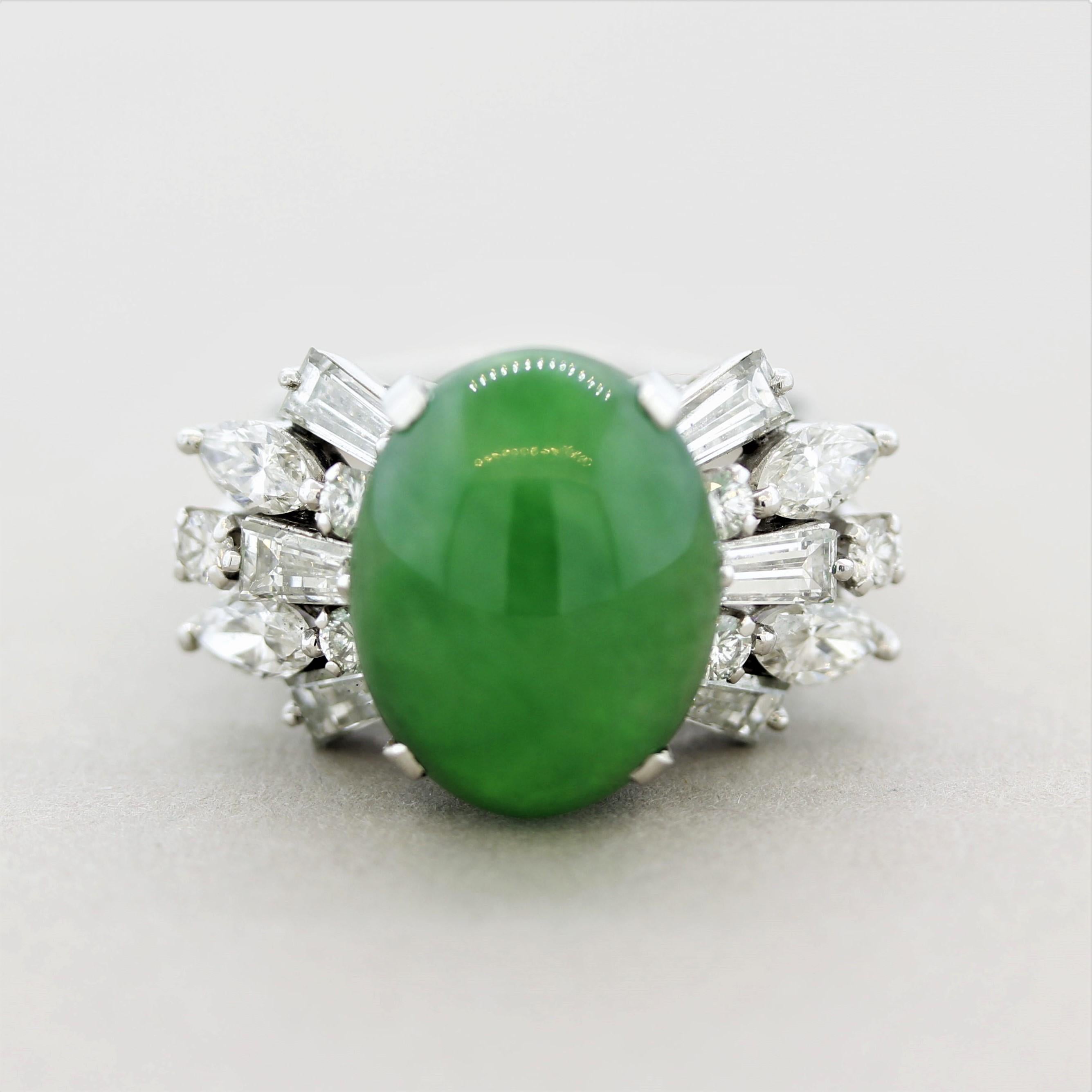 A large and impressive natural jadeite jade ring! The jade has a rich grass green color with great luster as light rolls across the stone and is not treated. It is accented by 1.72 carats of large round, baguette and marquise-shaped diamonds set in