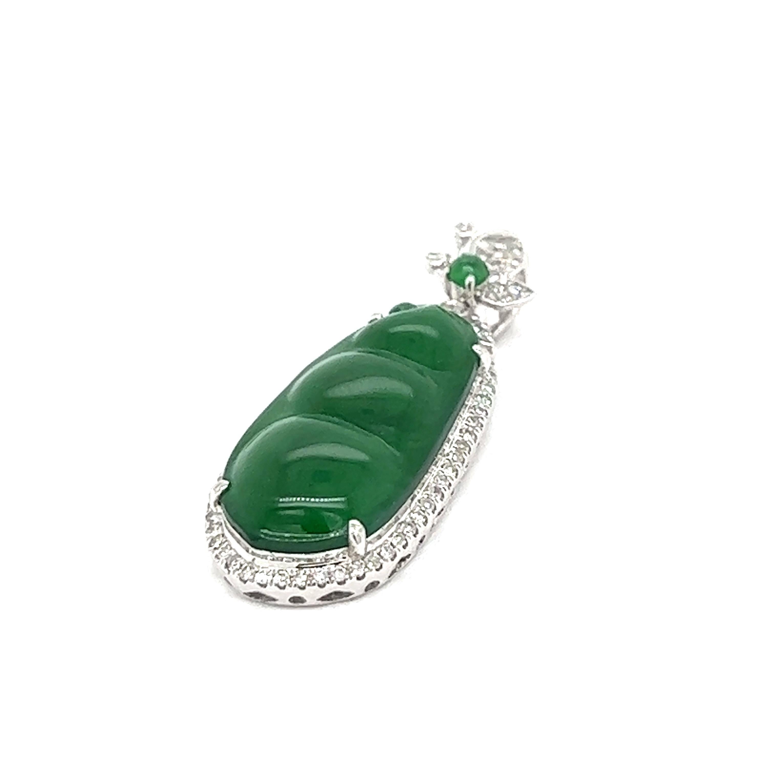 Jadeite Jade Peapod 18k White Gold Pendant

A peapod made of natural jadeite jade with no dye or impregnation detected, surrounded by round and single-cut diamonds, set on 18 karat white gold. Comes with Mason-Kay certificate.

Size: width 1.2 cm,