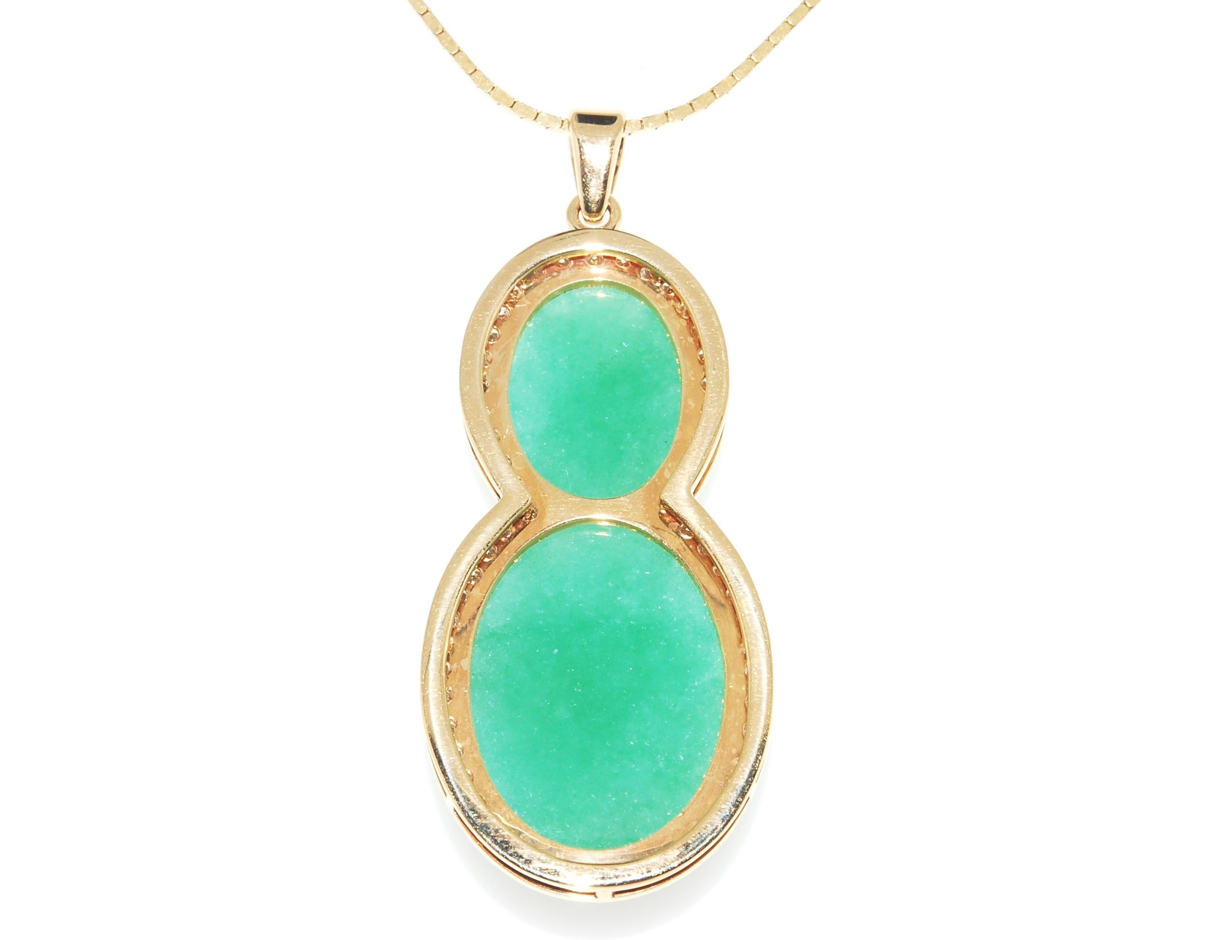 A beautiful Jadeite Jade pendant - with a lab report from Mason Kay - the leaders in Jade analysis. The Jadeites are set in 14 karat yellow gold. Larger piece is 22.26mm's x 16.2 mm's - the smaller 14.90 x 11.40mm's. They are framed in 14 karat