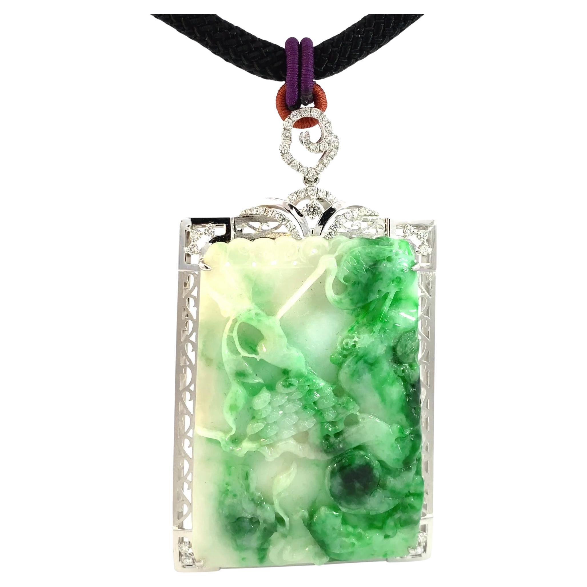 Article #9077 

Certifié GIA
Pendentif Jade 18K 1.05ct Diamant
Le pendentif et la bague en or blanc sont sertis de nombreux diamants ronds de taille brillant presque incolores. 
Forme : Sculpture percée
Jadeite Jade
