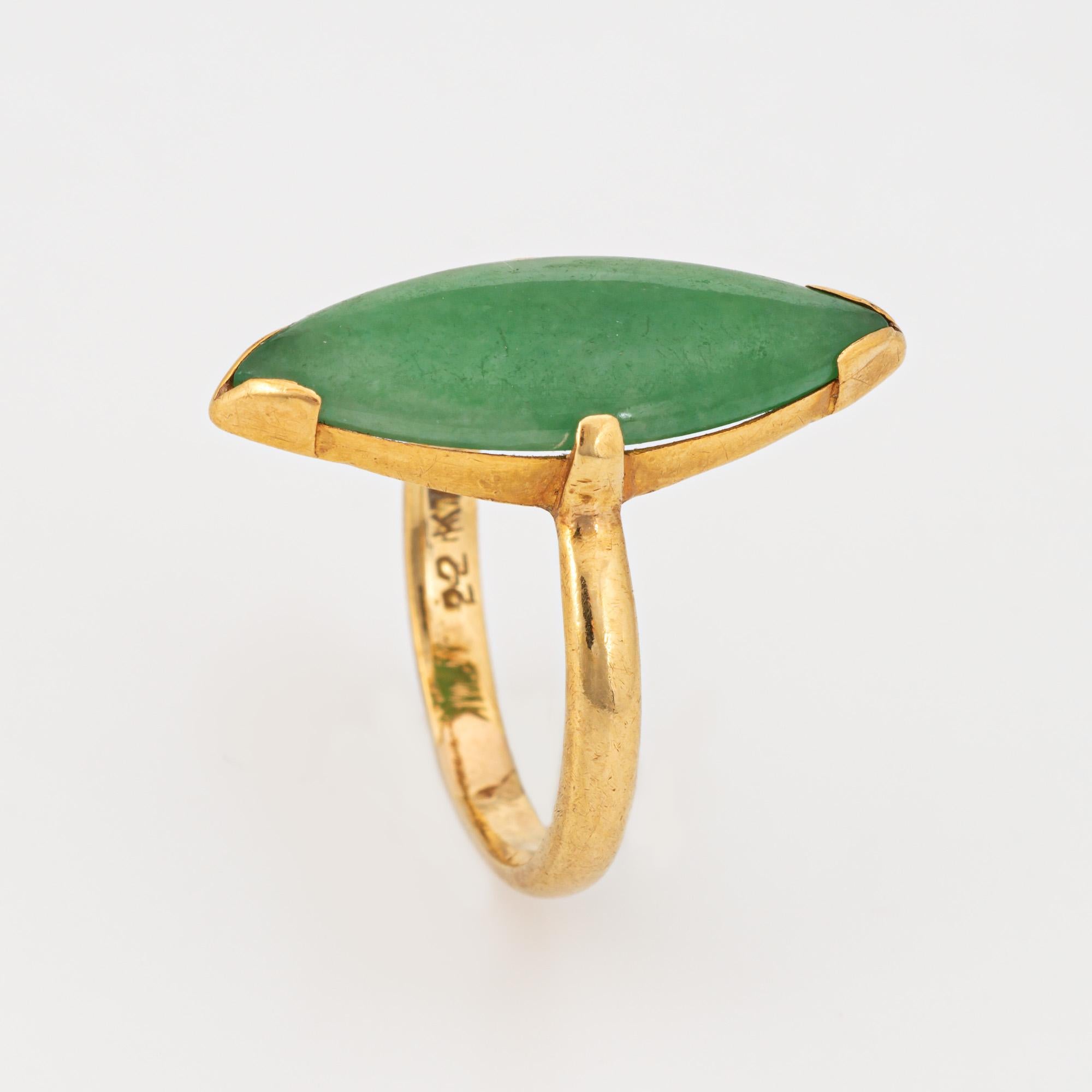 Stylish vintage jade navette ring (circa 1960s to 1970s) crafted in 22 karat yellow gold. 

Jade measures 20mm x 7.5mm. The jade is in good condition and free of cracks or chips (light surface abrasions visible under a 10x loupe). 

The elongated