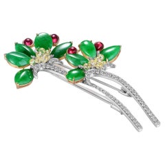 Broche fleur en or blanc et jaune 18 carats, tourmaline et diamants