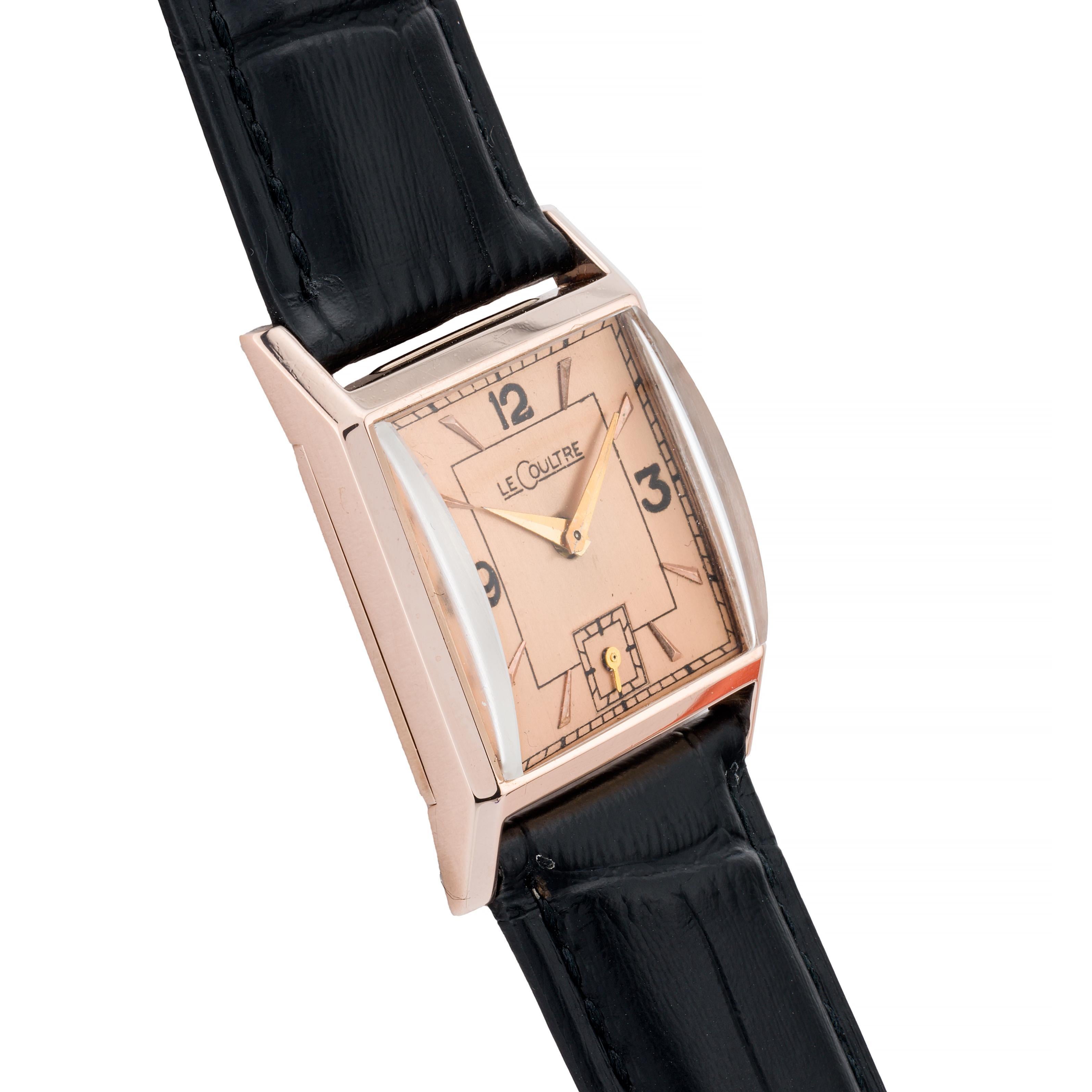 Aston Estate Jewelry Presents:

A vintage Jaeger-LeCoultre wristwatch crafted in 14k rose gold.

The square watch features a refined dial with bold black numerals at 12, 3, and 9 o'clock, and a small seconds subdial at 6 o'clock. The