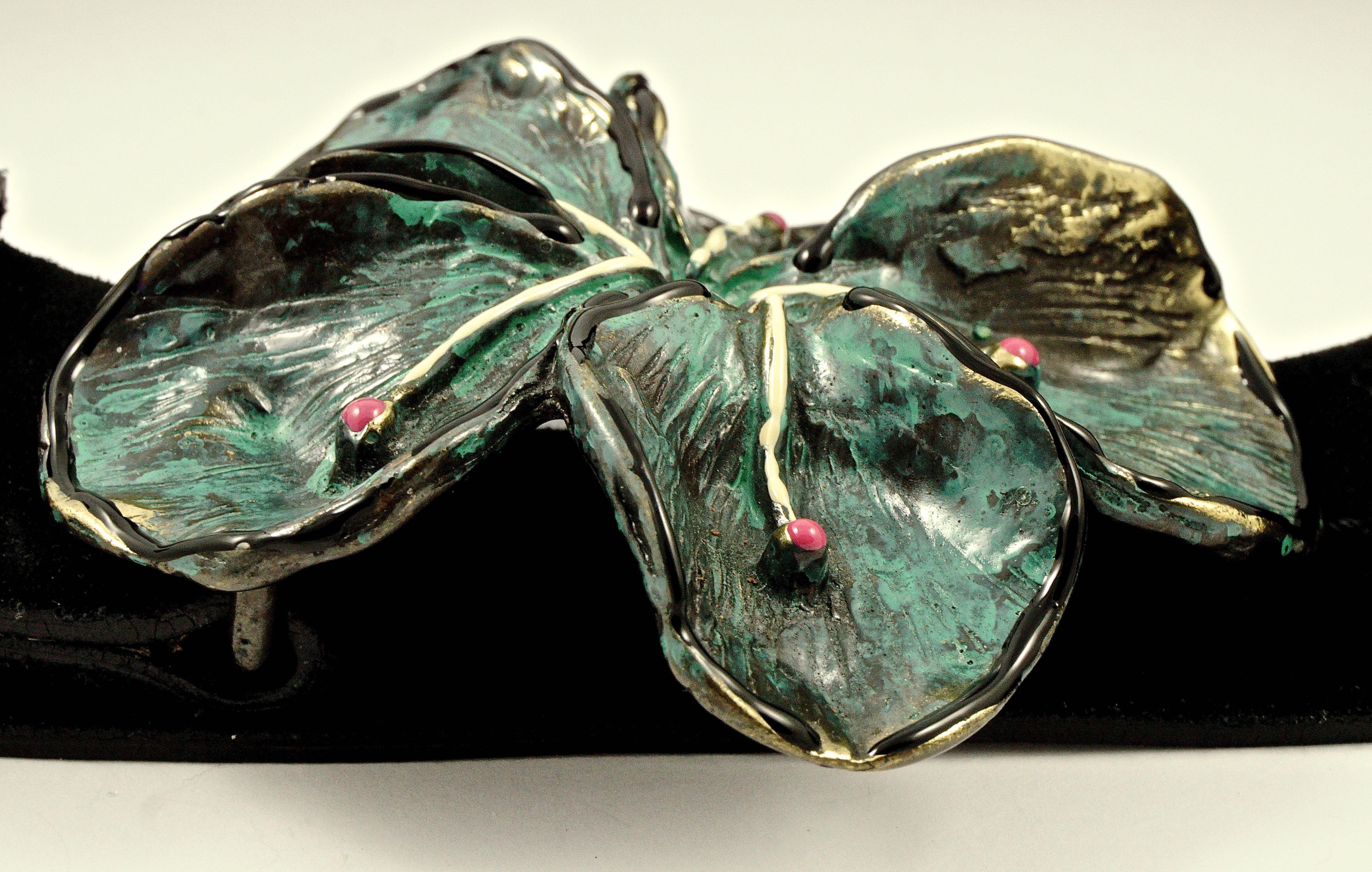 Jaeger Italian black suede leather belt (the suede is to the outside), featuring a lovely hand painted flower buckle in turquoise, cream, and pink, with black and gold highlights. The belt is labelled as Small and is adjustable from approximately