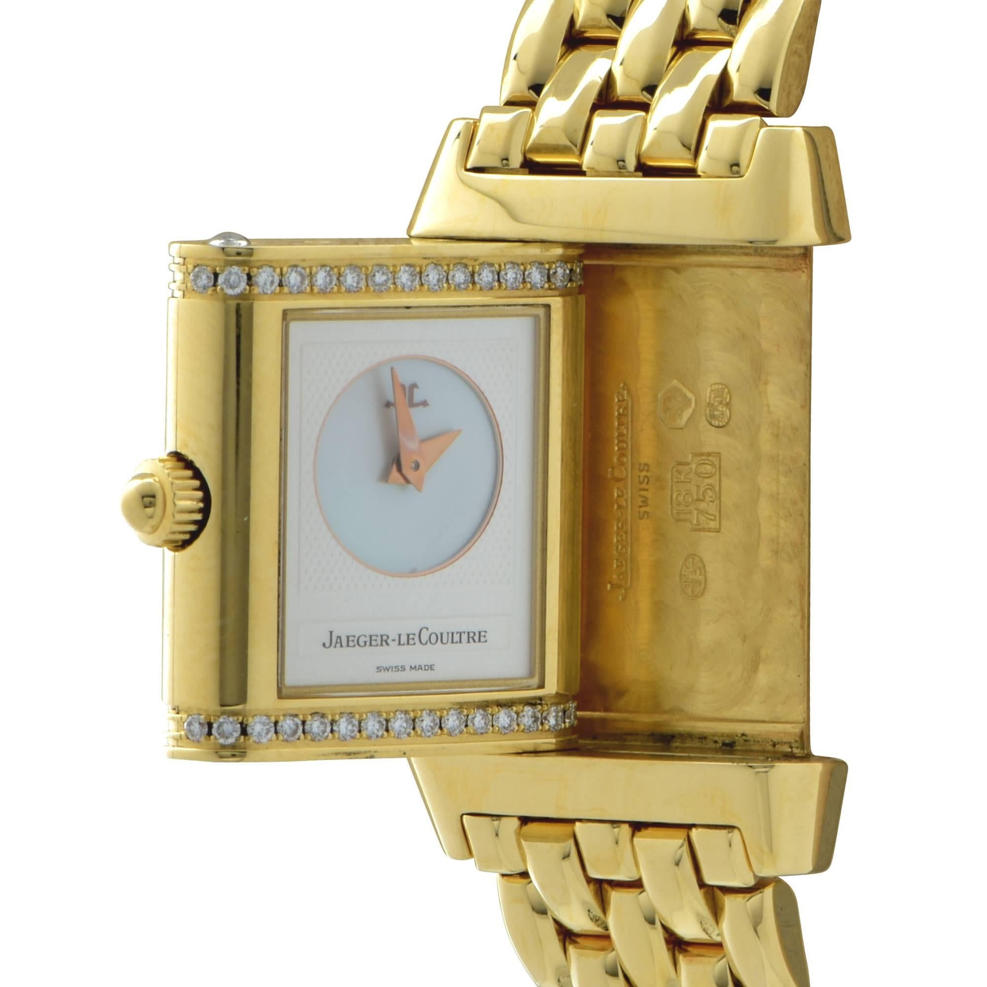 Jaeger-LeCoultre Reverso Duetto ladies wristwatch reference number 2141866 crafted in 18k yellow gold and studded with 32 round brilliant cut diamonds. The watch has a 21 mm diameter and 33 mm length, sapphire crystals.  This timeless and feminine