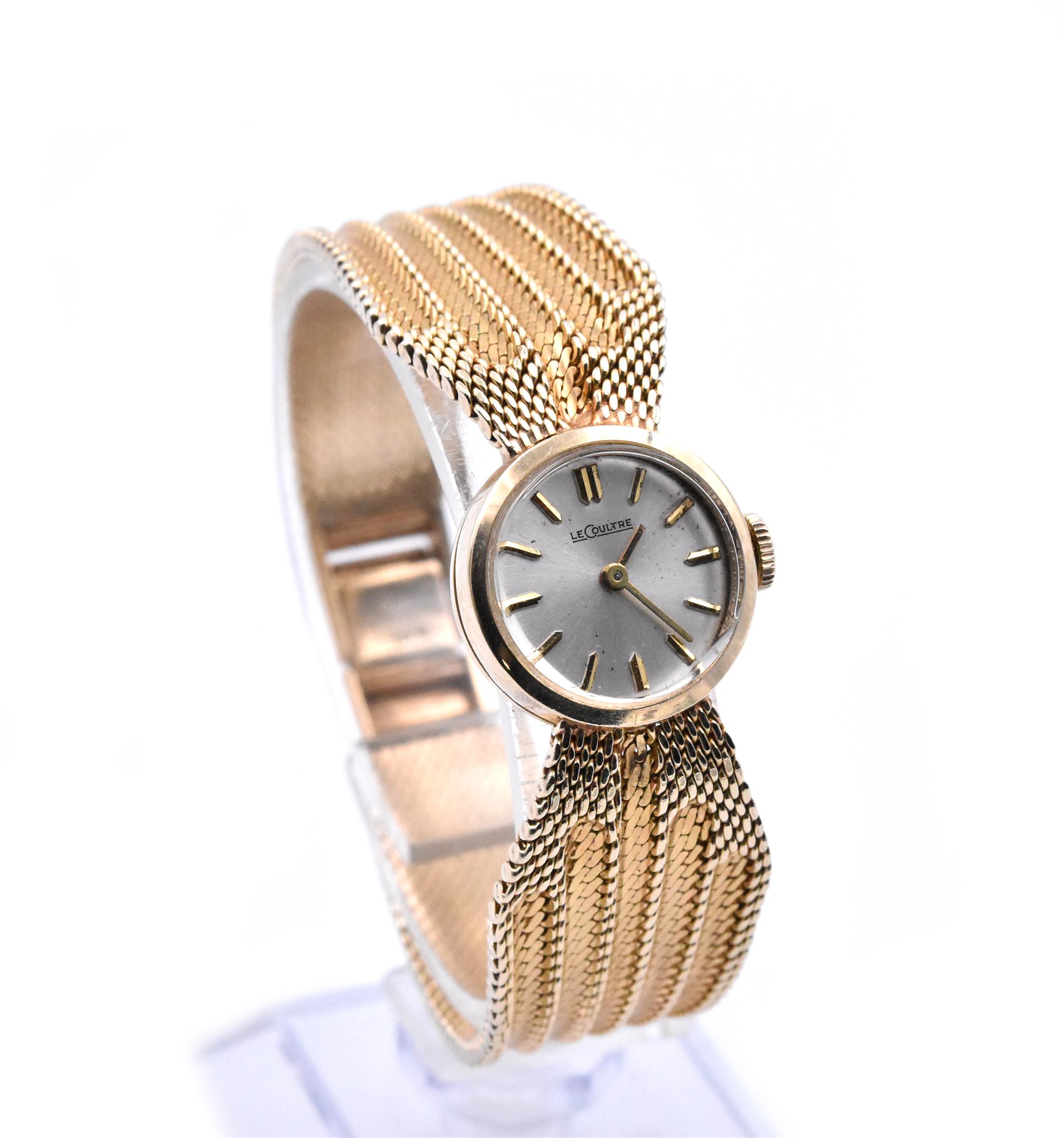 Movement: Manual Wind
Function: hours, minutes
Case: 17.5mm yellow gold circular case, push/pull crown
Dial: silver dial with gold hands and stick hour markers
Band: 14k yellow gold mesh bracelet with a locking clasp
Weight: 34.91 grams

Does not