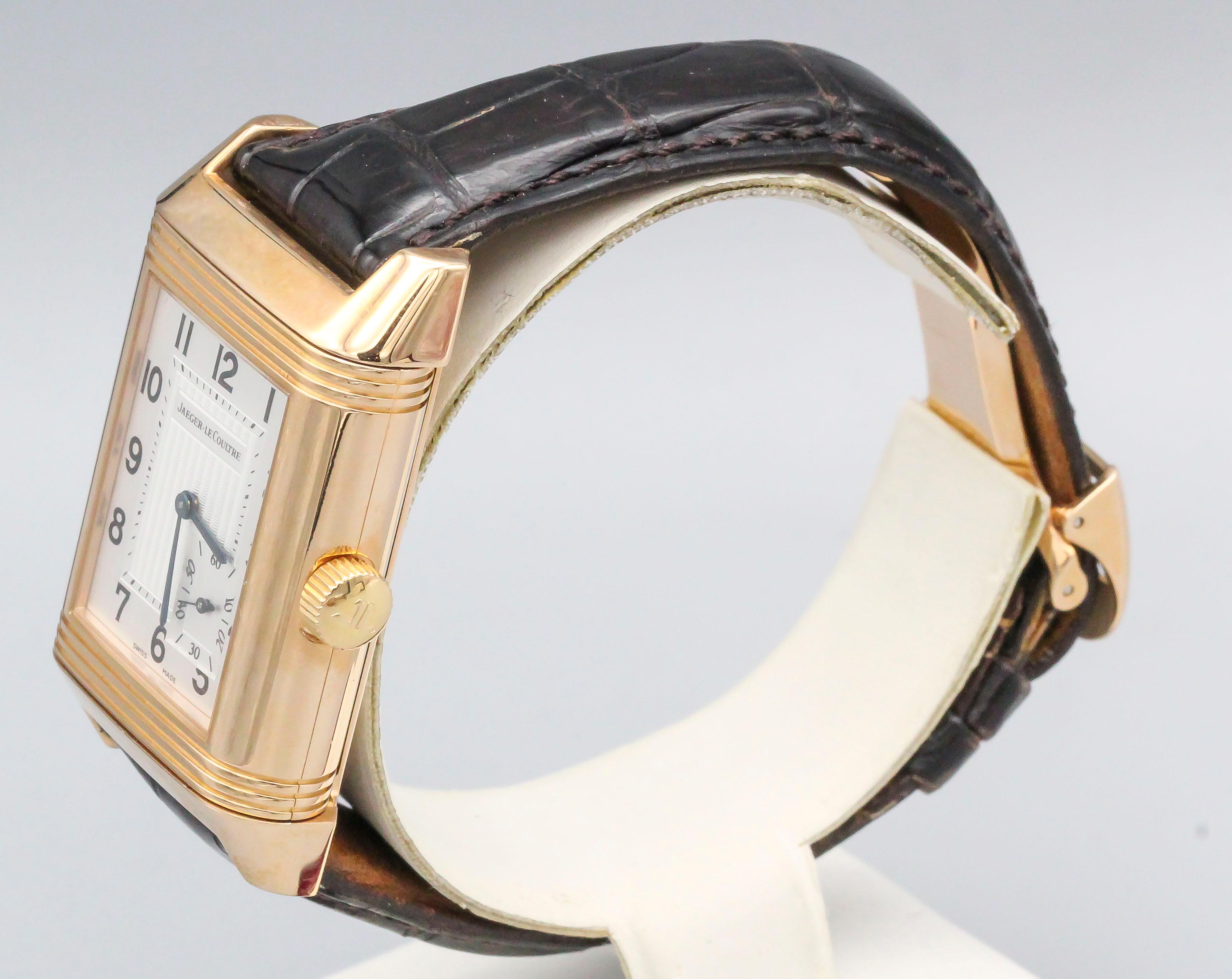 Timeless 18K Rose Gold Jaeger LeCoultre grande (large) reverso wristwatch. It features Arabic Numerals, automatic movement and offset seconds dial at 5 o'clock. The back shows power reserve in hours. Comes with original crocodile strap and JL