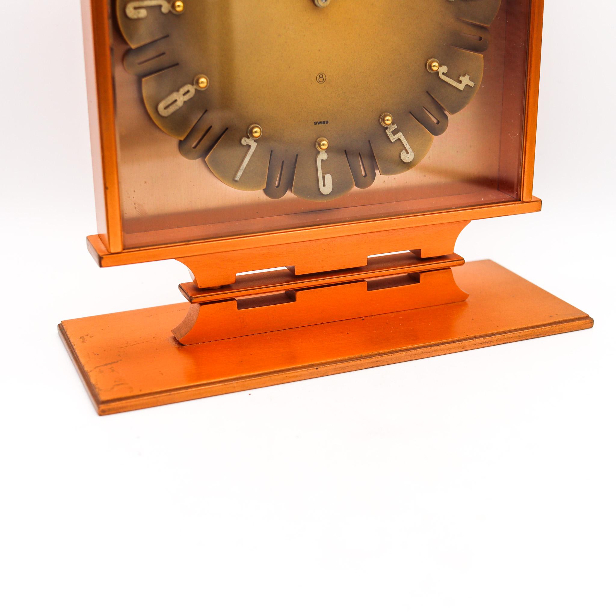 Desk clock designed by Jaeger LeCoultre.

Fabulous geometric desk-table clock, created in Switzerland by the clockmakers of Jaeger LeCoultre, back in the 1950. This clock is very rare and has been crafted with retro modernist patterns in solid