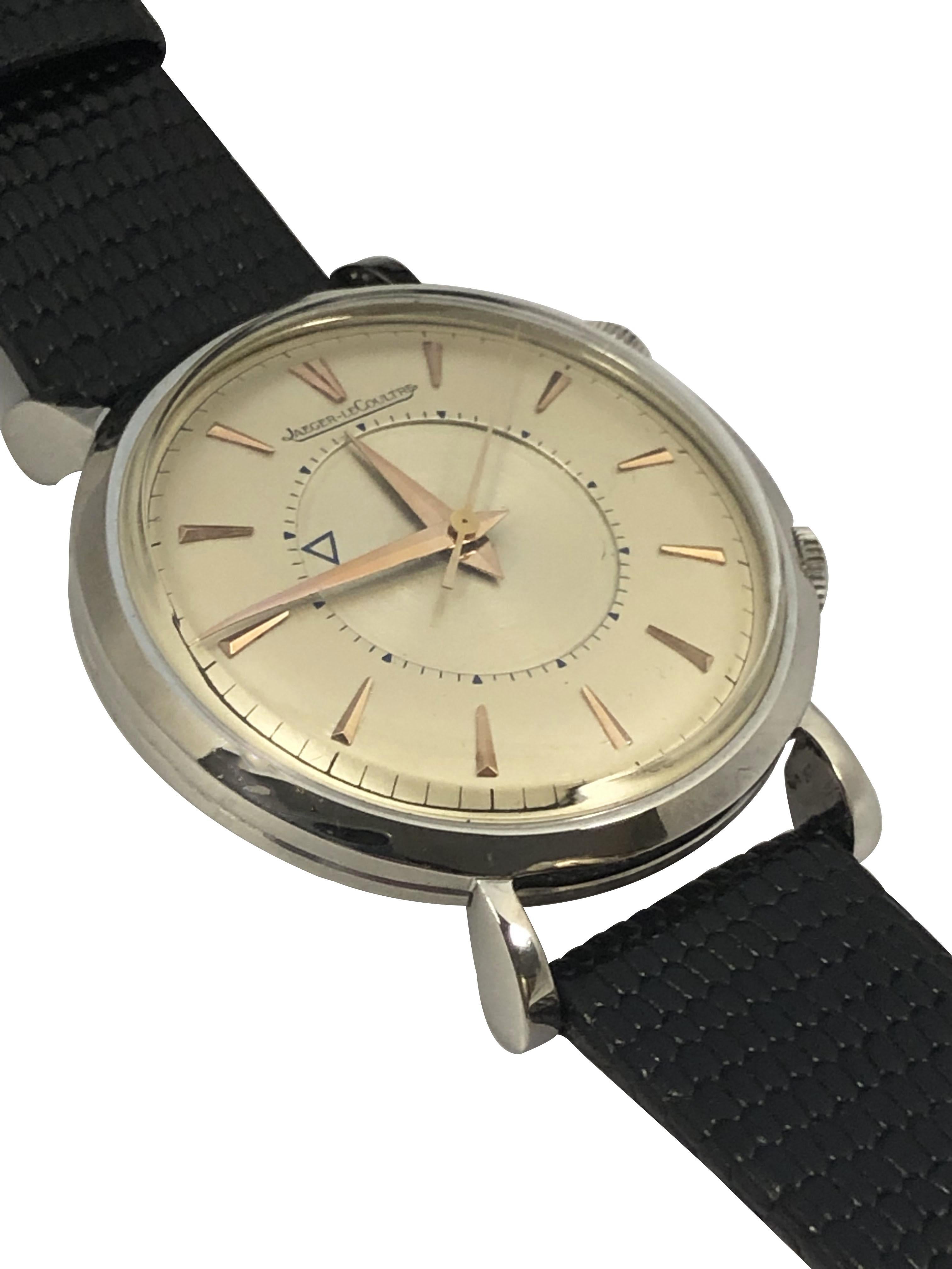 Circa late 1950s Jaeger LeCoultre Memovox Alarm Wrist Watch, 34 M.M. 2 piece Stainless Steel case with Tear Drop lugs, Caliber P489 Manual wind movement with Alarm Function, Original and Mint condition Silver Satin dial with Rose Gold Raised markers