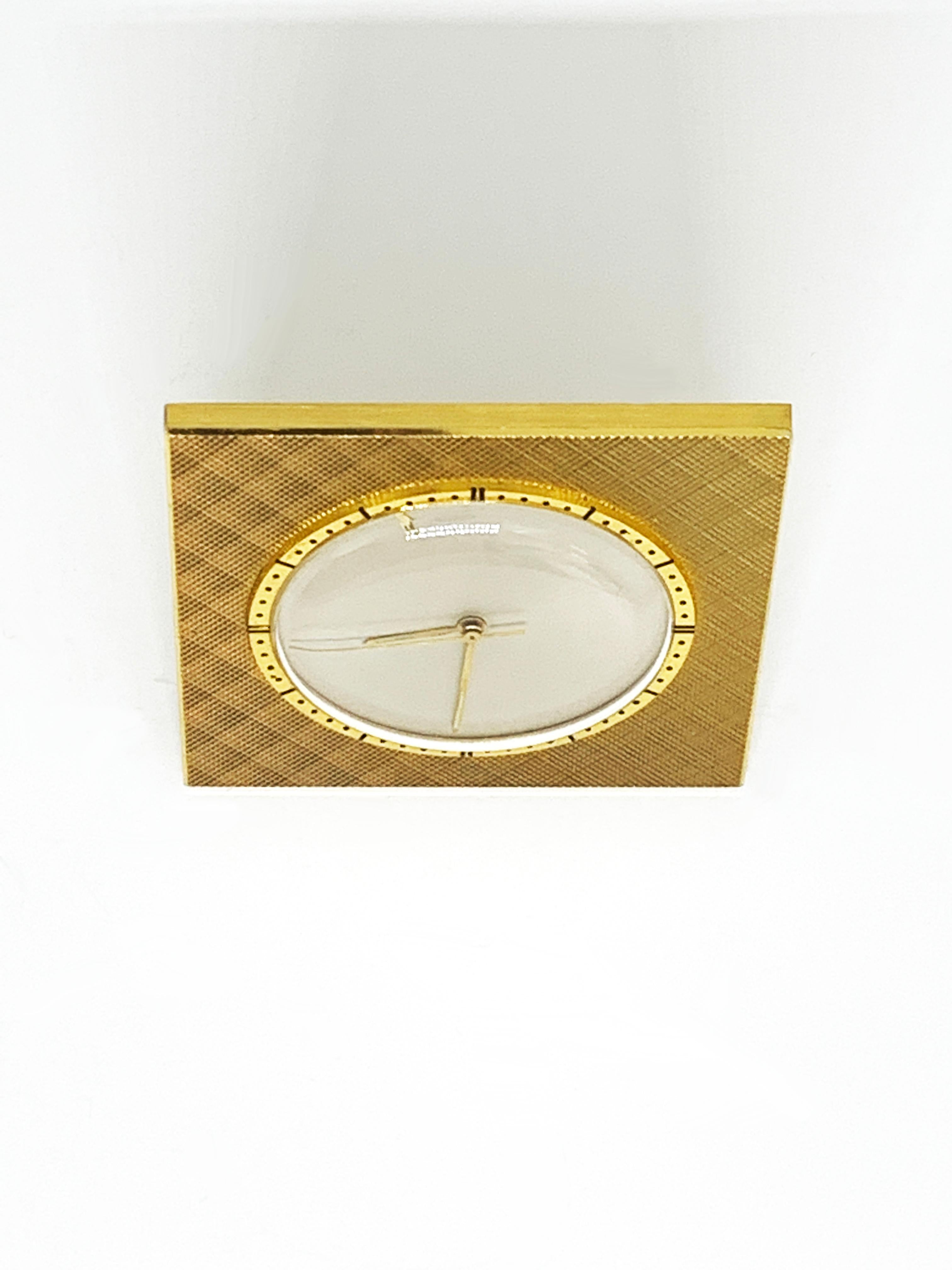 Jaeger-LeCoultre, circa 1966 that has been revised.
Alarm clock
Brass case
mother-of-pearl dial
Mechanical movement with manual winding. Caliber K910
Dim: 44x44mm
dated on the back
Original case - 
very nice condition
980 euros