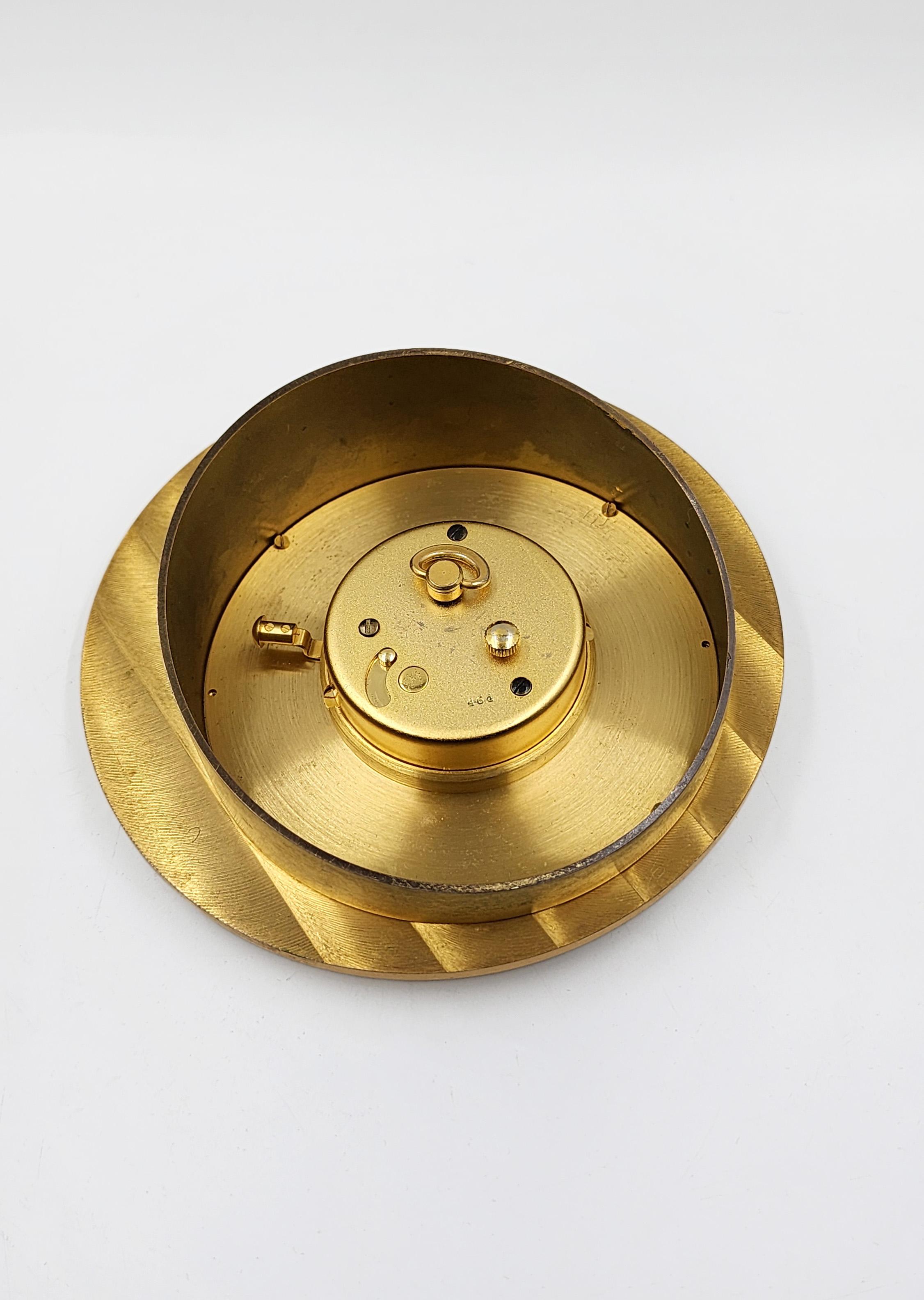 Jaeger LeCoultre 8-Day Desk Clock with Date
This Jaeger-LeCoultre desk clock is a classic piece of Swiss watchmaking, known for its hand-wound 8-day movement. Its design evokes the aesthetics of the mid-20th century, a time when desk and travel