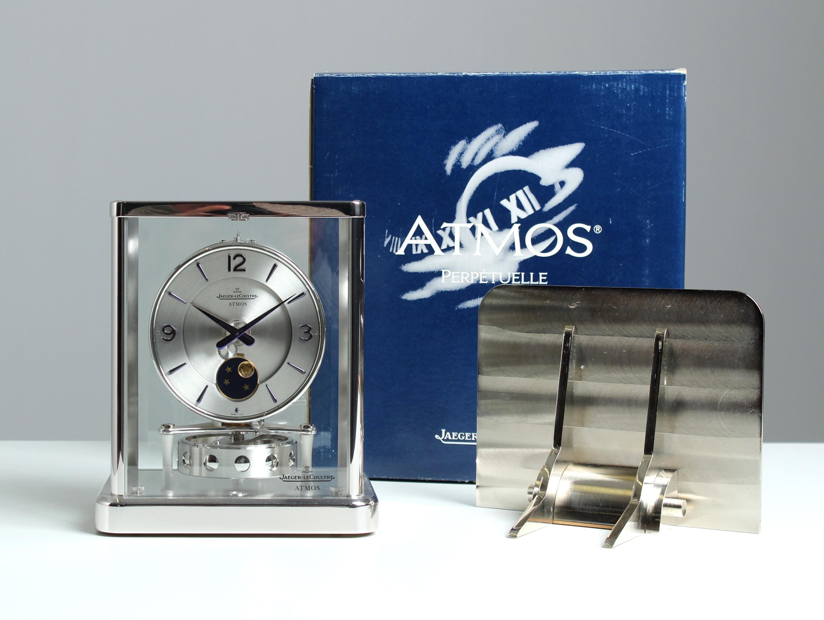 Rhodium plated Atmos clock with moon phase on wall console

Switzerland
Rhodium-plated brass
1990s

Dimensions: H x W x D: 23 x 20 x 15 cm

Description:
Atmos calibre 540 with moon phase in a rhodium-plated case.
Silver, matt brushed full dial with