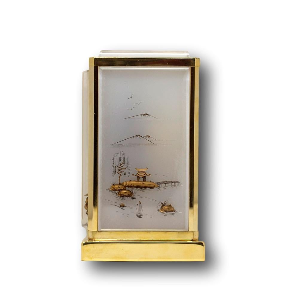 Fine and rare Jaeger-LeCoultre Atmos Marina clock. The clock from the Marina series in white Lucite featuring Chinoiserie panels with a figure fishing to the front amongst foliage and large landscape scenes with boats and mountains. The model
