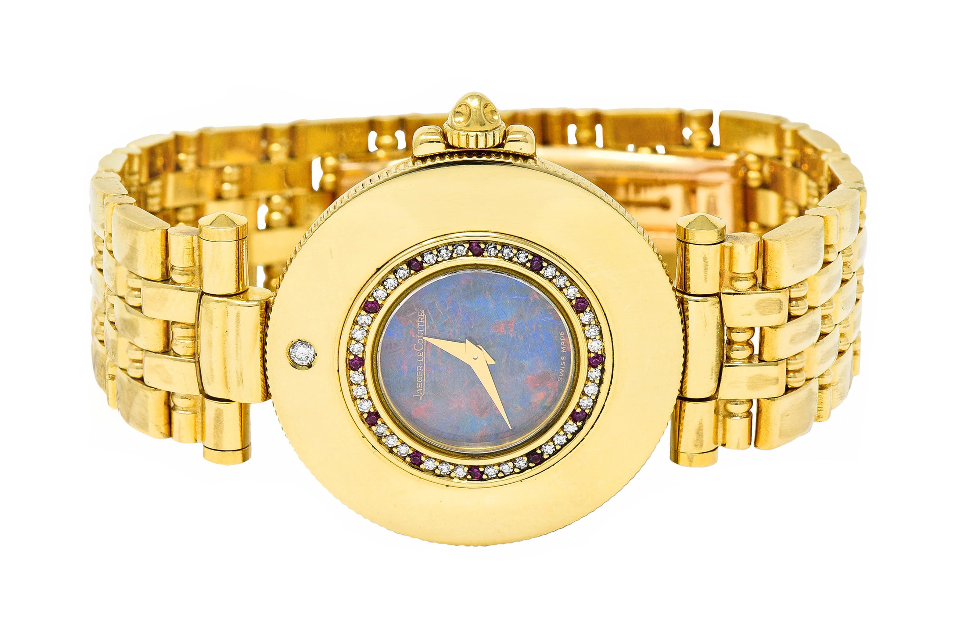 Watch bracelet features a 30.0 mm circular watch case centering a 15.0 mm opal watch face

With very strong spectral play-of-color and broad flashes of red with blue

Covered by sapphire crystal with a halo of round cut rubies and single cut