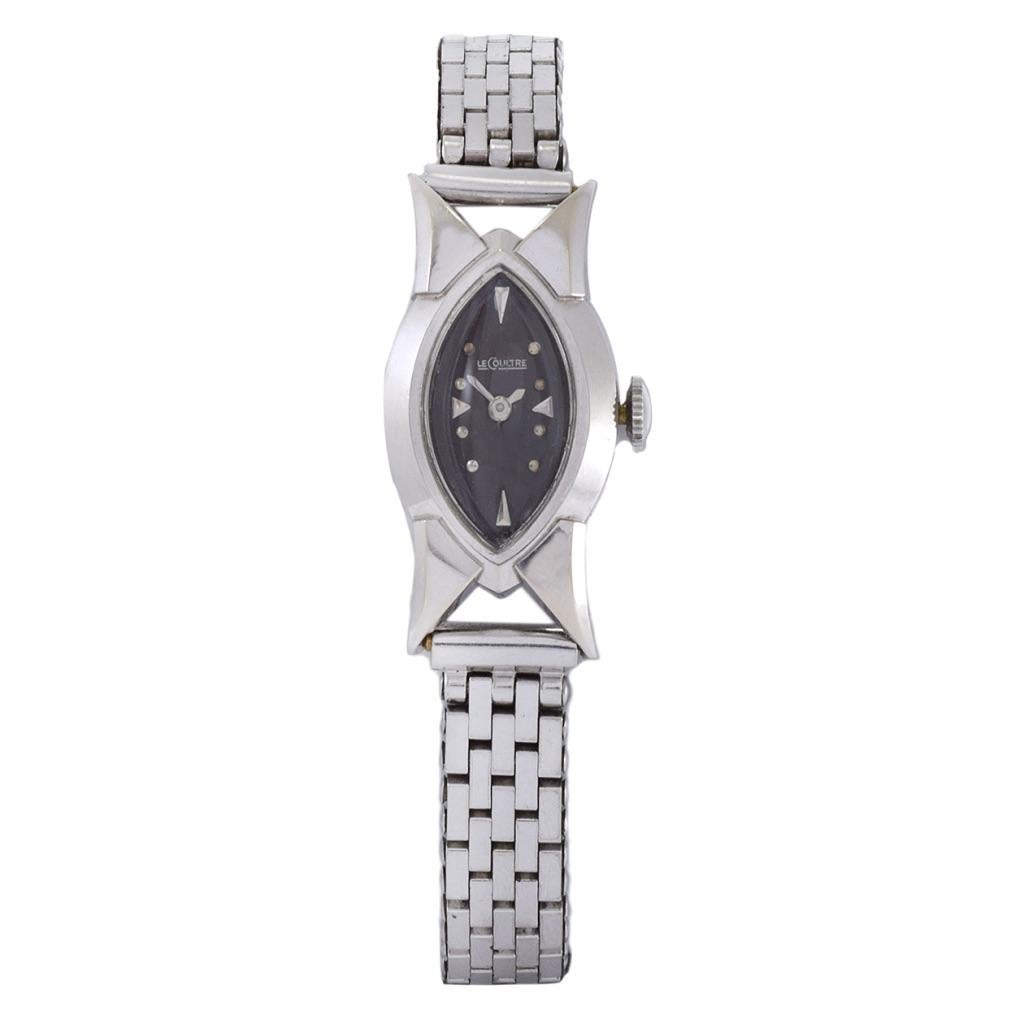 Introducing the vintage 1960's 14K White Gold LeCoultre ladies wristwatch, a true testament to timeless elegance and sophistication. This exquisite timepiece features a 28x20mm marquise-shaped white gold case with fancy style lugs, and a matching