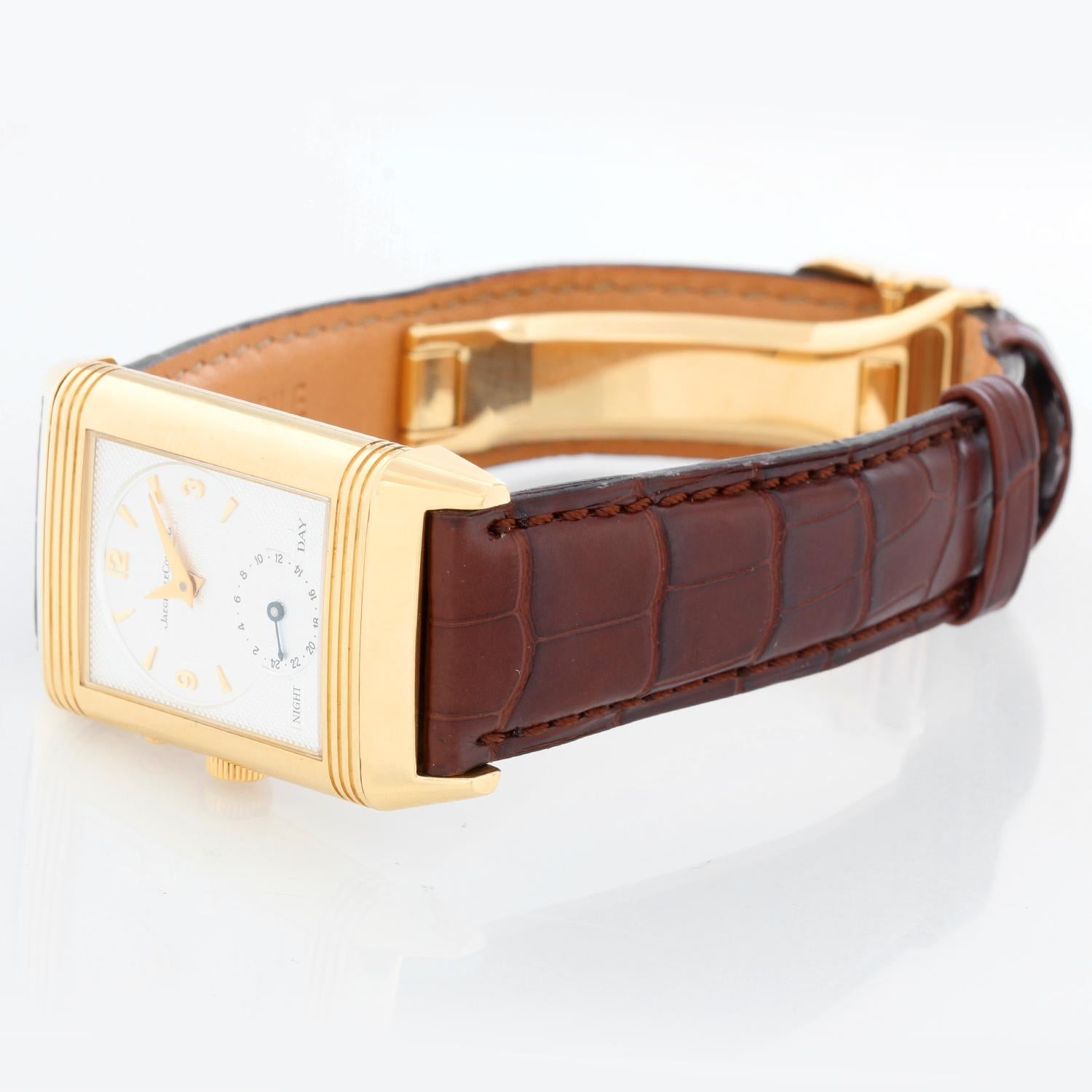 Jaeger-LeCoultre Day-Night Reverso 18k Yellow Gold Men's Watch (270154) 270.1.54 - Manual winding, 21 jewels. 18k yellow gold Reverso case (26mm x 42mm). Silver guilloche dial with black Arabic numerals and subseconds dial; reverses to silver