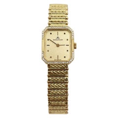 Jaeger-LeCoultre Montre pour femme en or jaune 18 carats avec lunette en diamants