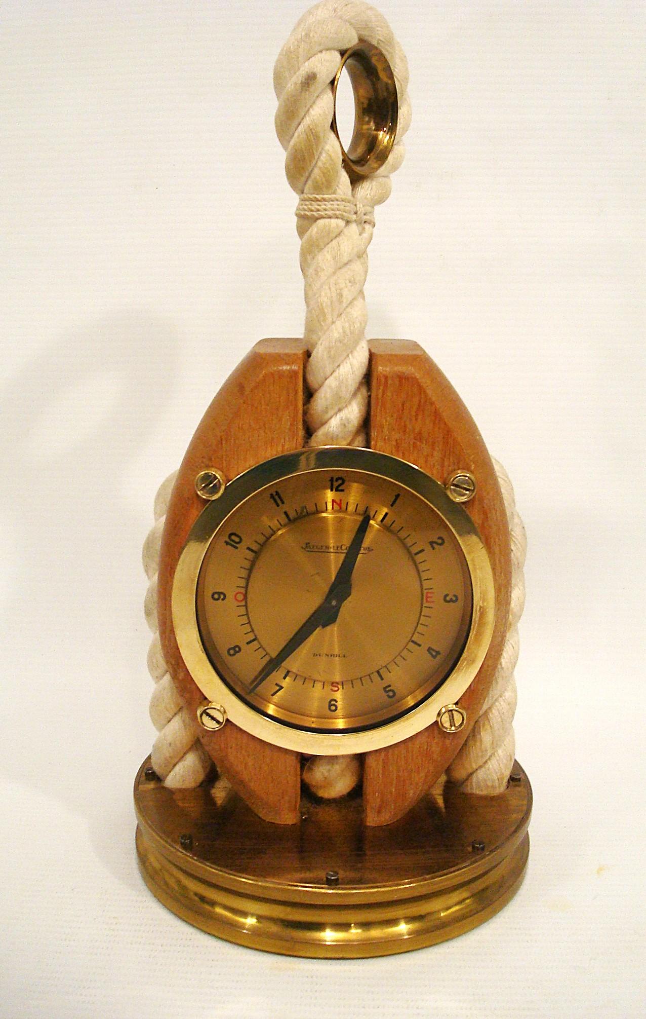 Jaeger LeCoultre Dunhill Desk clock signed Maritime / Nautical design. This Rare Dunhill / Jaeger lecoultre clock is one that we have never seen before. It is made of brass, wood and rope. Super quality.
Extremely rare and special table clock by