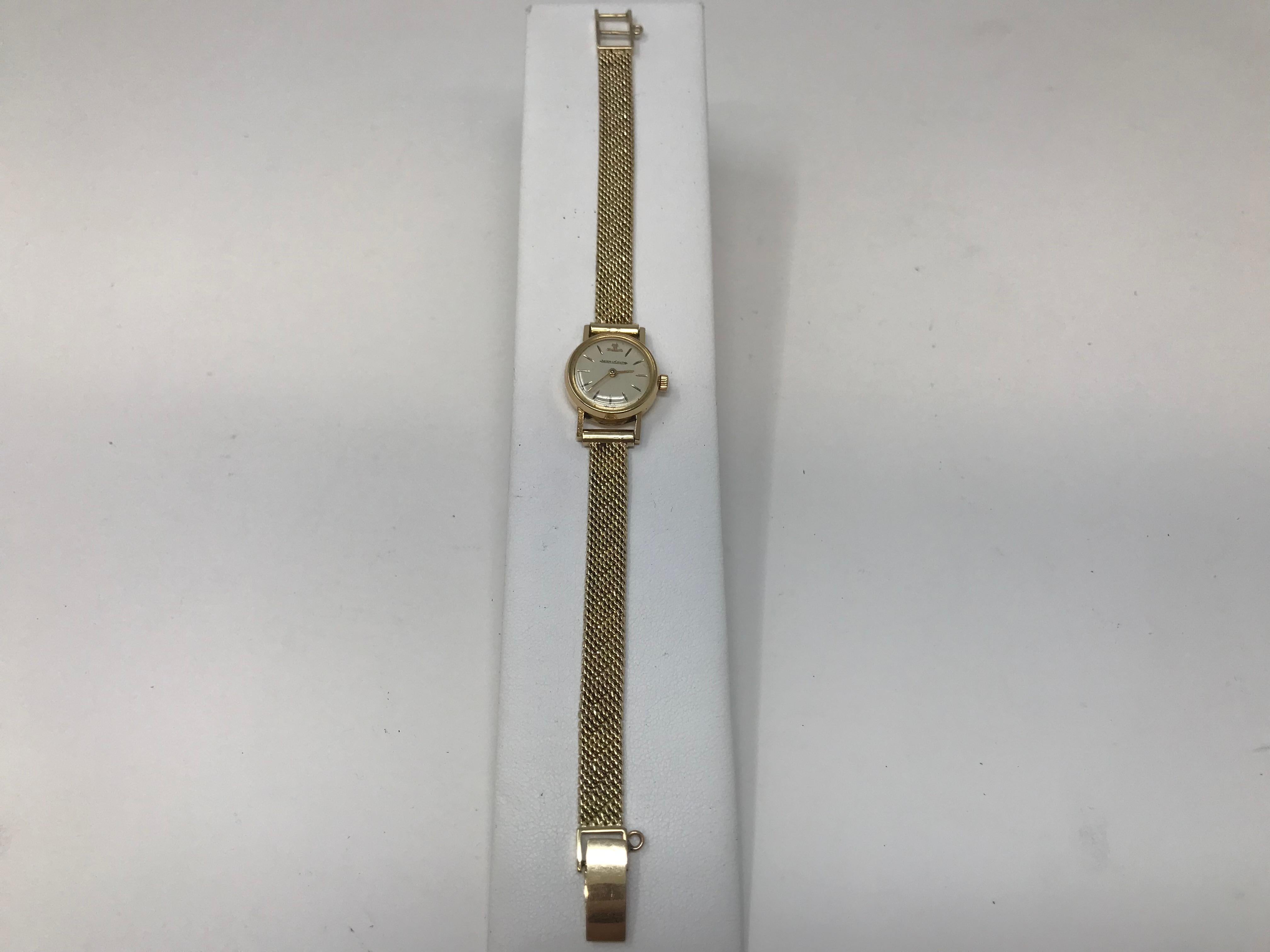 Jaeger LeCoultre 18k yellow gold case ladies watch with 14k yellow gold bracelet, marked inside the case and on the bracelet, case measured 18mm in diameter, watch will fit to a 7 inch wrist. In good working order preowned,  weighs 22 grams.