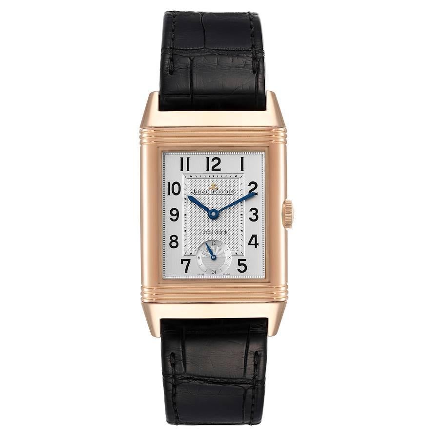 Jaeger LeCoultre Grande Reverso Rose Gold Watch 278.2.56 Q3802520 Box Papers. Manual winding movement. 18K rose gold rectangular rotating case 46.8 x 27.4 mm. Case flips over. 18K rose gold ribbed bezel. Scratch resistant sapphire crystal. Silver