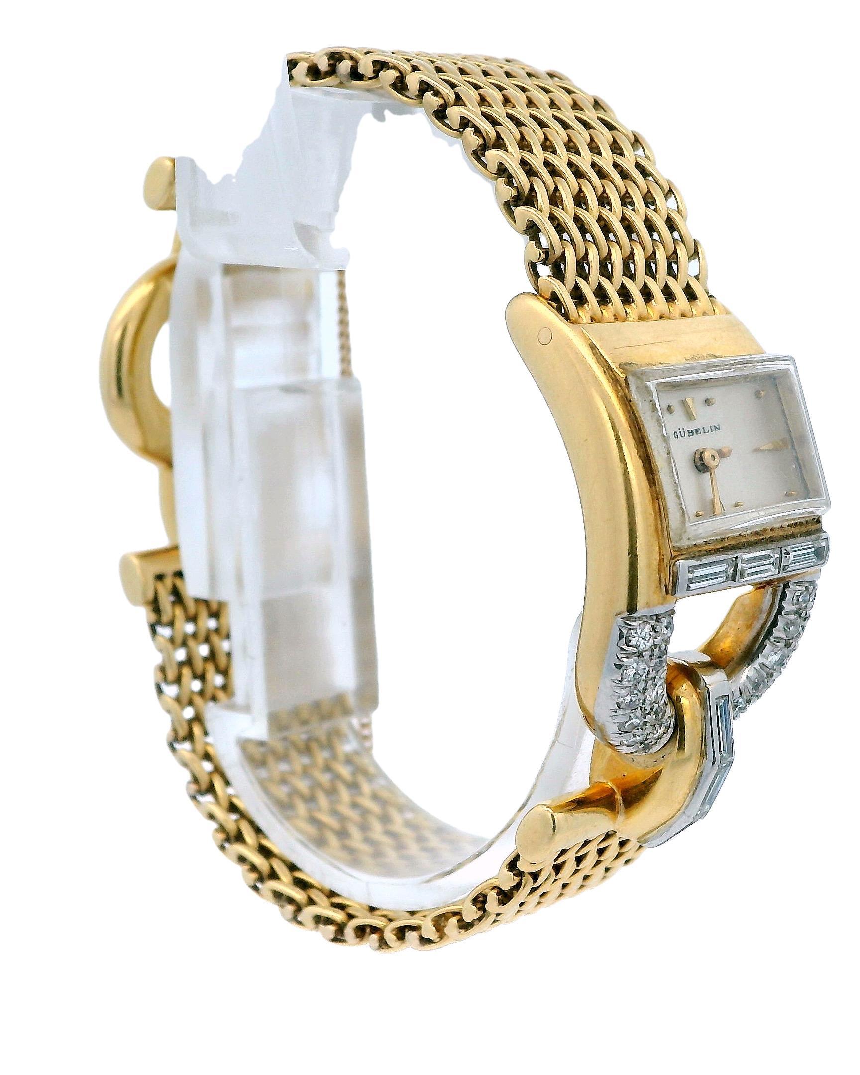Elegant Gübelin 18K Yellow Gold and Diamond Watch with movement signed Jaeger Lecoultre. This exquisite timepiece is crafted in 18k yellow gold. The watch features a rectangular face with a silver dial, accented by delicate gold hour markers. The