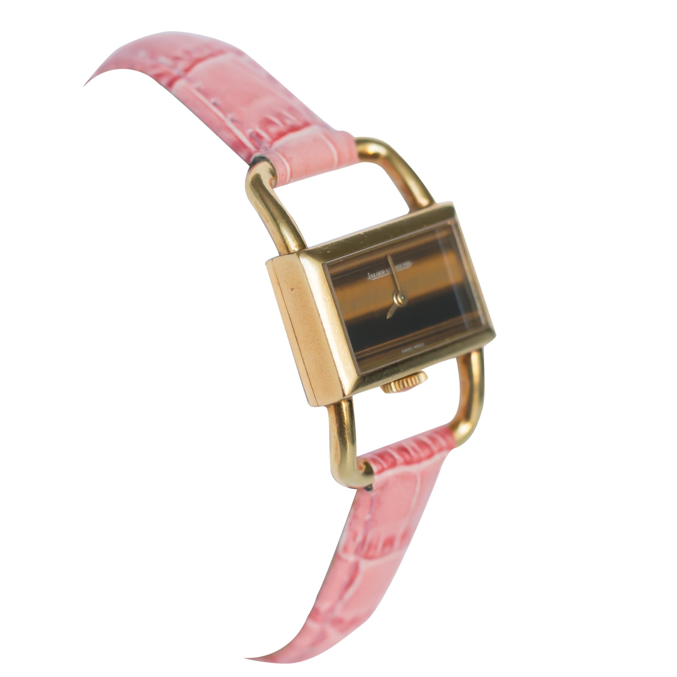 Item Details: 
Maker: Jaeger LeCoultre & Hermes
Dial: Tigers Eye
Type: Manual Wind
Metal Type: 18K Yellow Gold [Hallmarked, and Tested]
Band: Aftermarket Strap, New Pink

Condition: Excellent