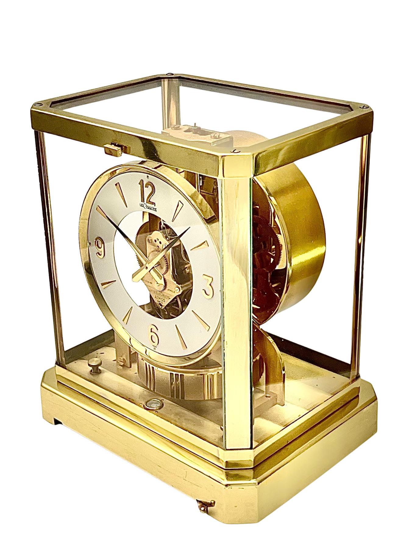 A stunning Mid Century Jaeger LeCoultre Atmos clock, model 528-8 with circular dial and Arabic numerals. In its glass case, the Atmos clock’s unique design allows the owner to see the complexity of the machinery from all angles. As with all Atmos