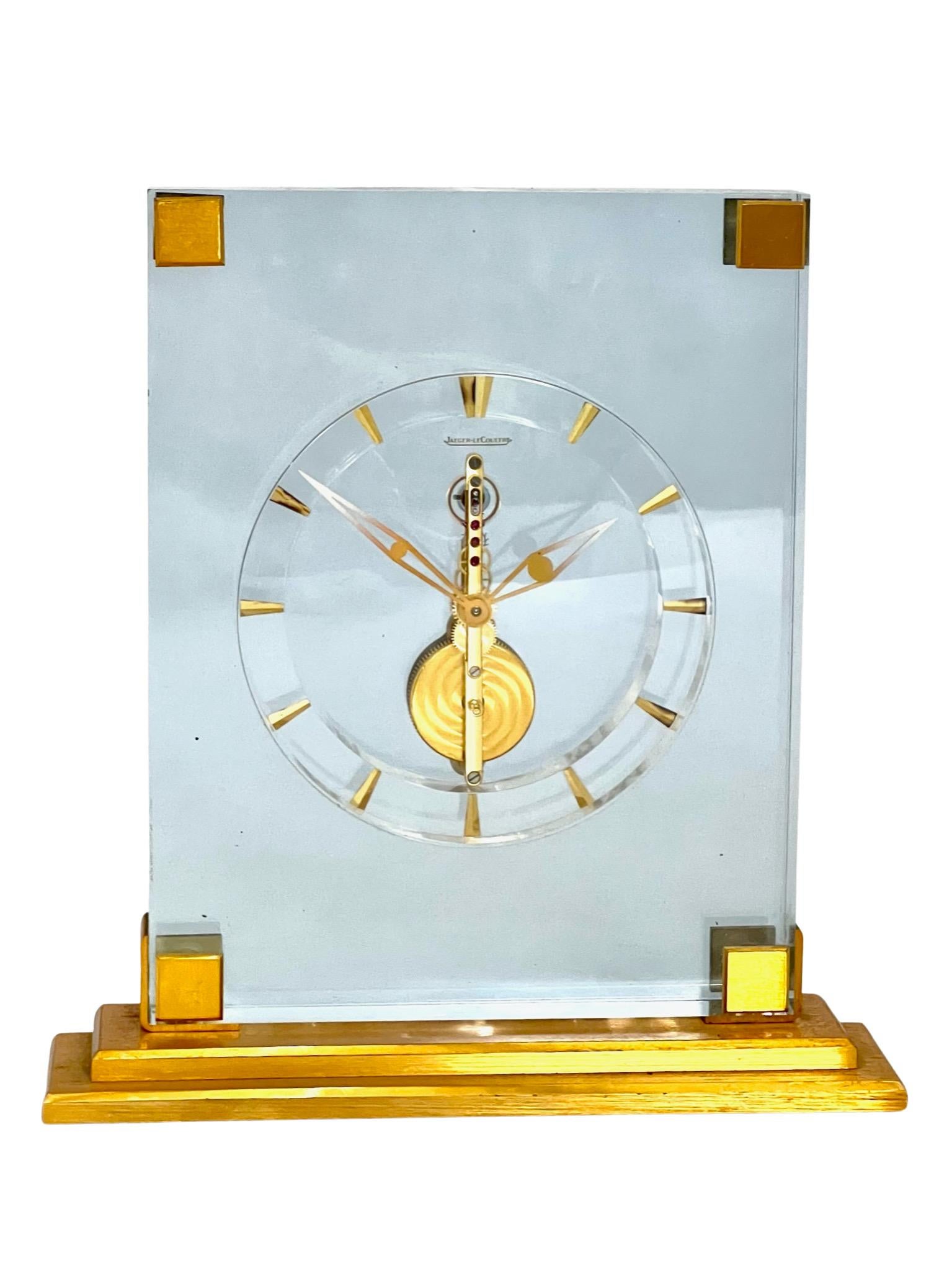 A beautifully unusual light blue lucite and brass Jaeger LeCoultre Inline Skeleton Clock, with a clean minimalistic design which would look stylish in any setting. The beauty of these skeleton clocks is that you can see the 16 jewel Swiss movement
