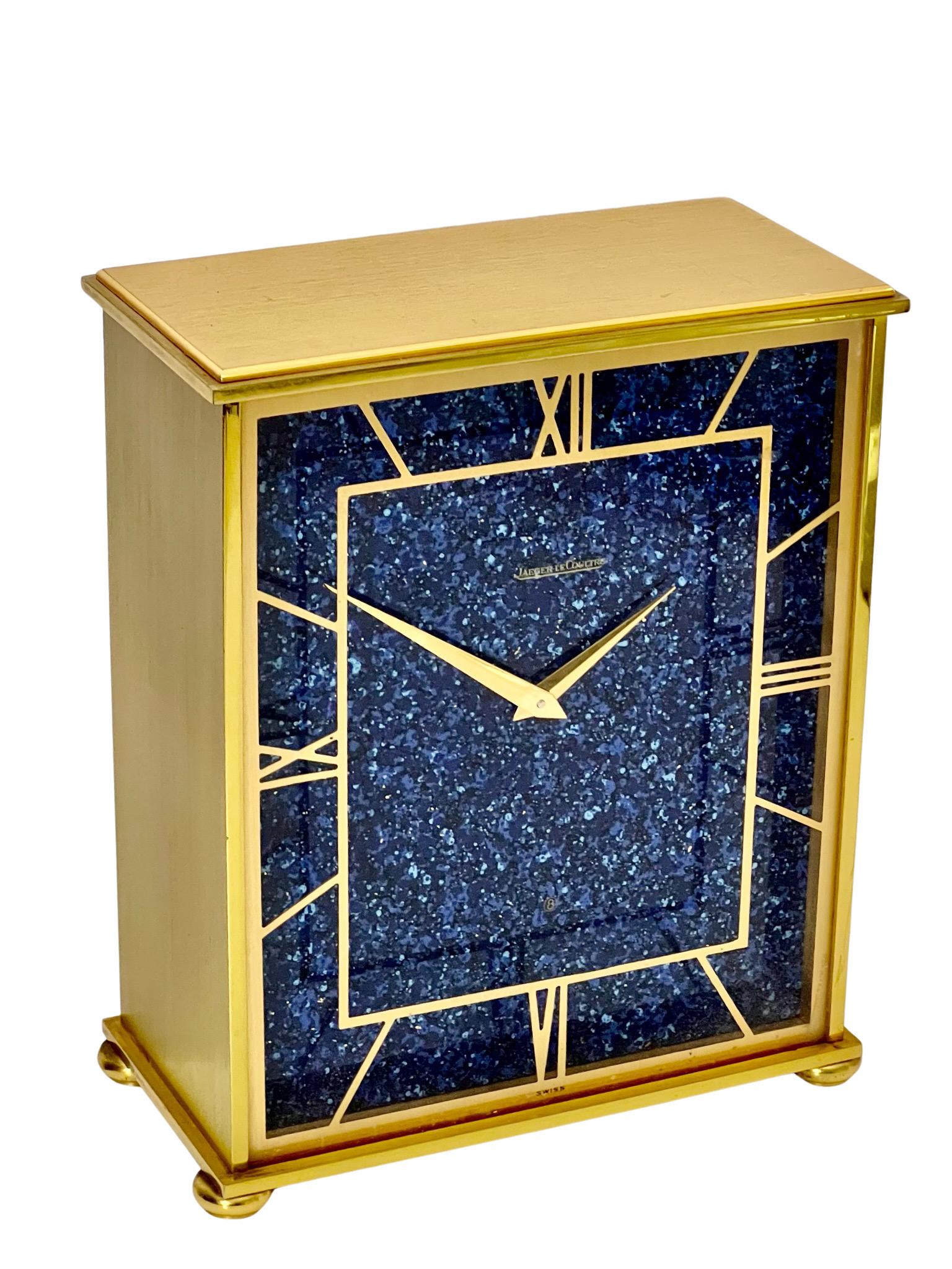 A beautiful mid century gold plated eight day timepiece mantel clock made by Jaeger LeCoultre, La Chaux-de-Fons, Switzerland.

Mid century clocks make stunning statements in your home. They blend extremely well with any décor and are very in