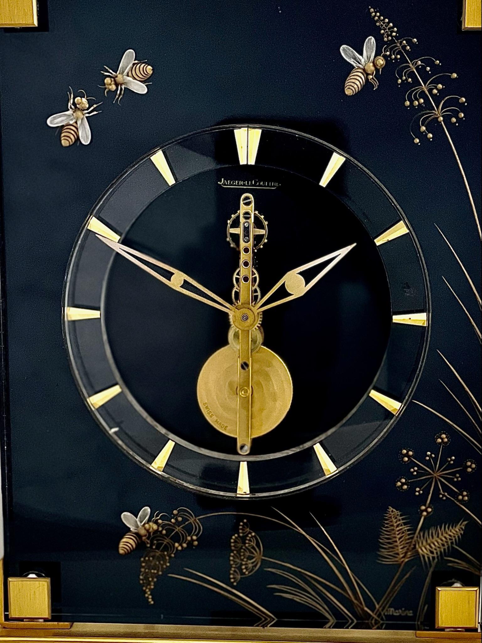 A stunning Swiss Mid Century Jaeger LeCoultre Marina Eight Day clock with a skeletonised baguette movement. This is a Marina Bees Model no. 404.

The clock has a polished gilt brass and lucite case with a black background. It is beautifully