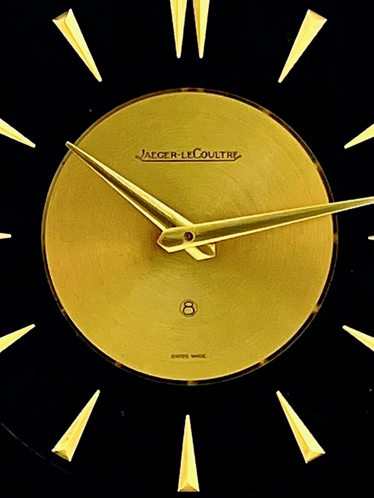 Beautiful Jaeger LeCoultre mid century Marina eight day clock with a detailed naturalistic design.

With a polished gilt brass and lucite case with a black background, this clock is beautifully decorated with a scene from nature showing a