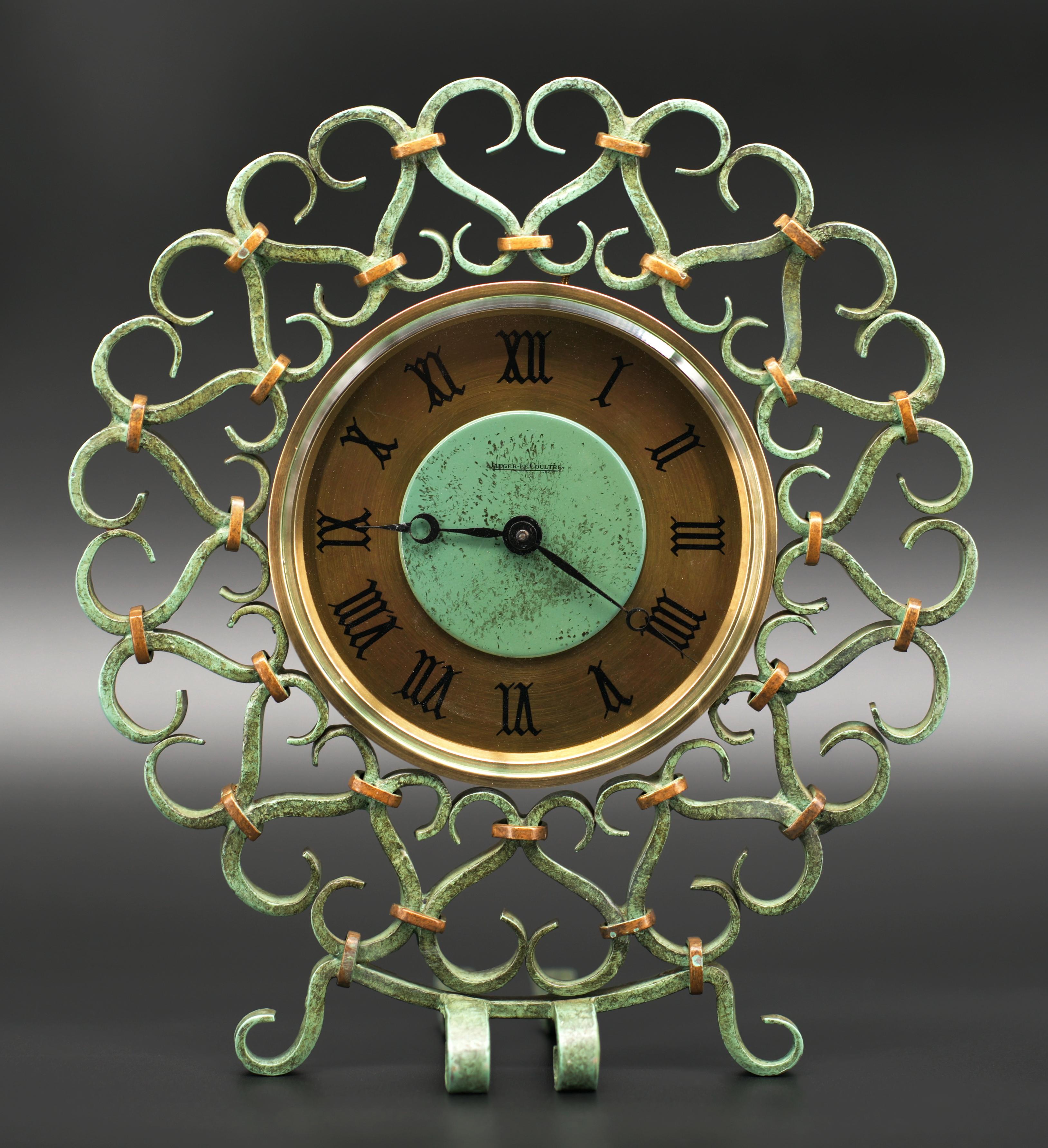 French Mid-century 8 day table clock by Jaeger-Lecoultre, France, ca.1950. The wrought iron frame was designed by Gilbert Poillerat. Height: 8.9