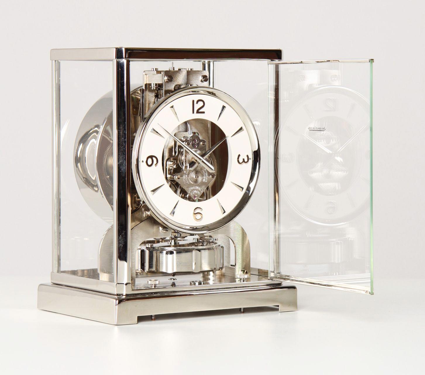 Silver Atmos clock by Jaeger LeCoultre

Switzerland
Nickel-plated brass
Year of manufacture 1956

Dimensions: H x W x D: 22 x 18 x 13.5 cm

Description:
Atmos V calibre 526 in a nickel-plated case.
White dial ring with silver numerals 3, 6, 9, 12