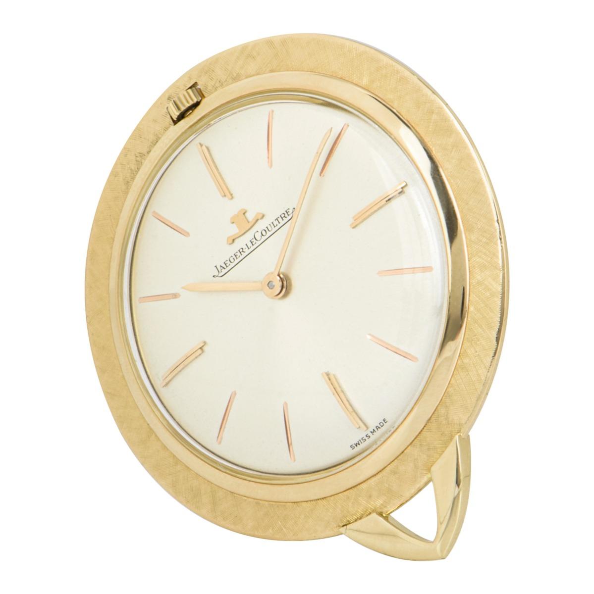 A 39 mm vintage pendant pocket watch by Jaeger LeCoultre, crafted from 18k yellow gold.

Featuring a silver dial with applied hour markers, a fixed 18k yellow gold bezel, plastic glass and a manual wind movement. There is also a pendant bale