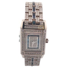 Jaeger LeCoultre Montre Reverso en or blanc 18 carats, diamants et saphirs
