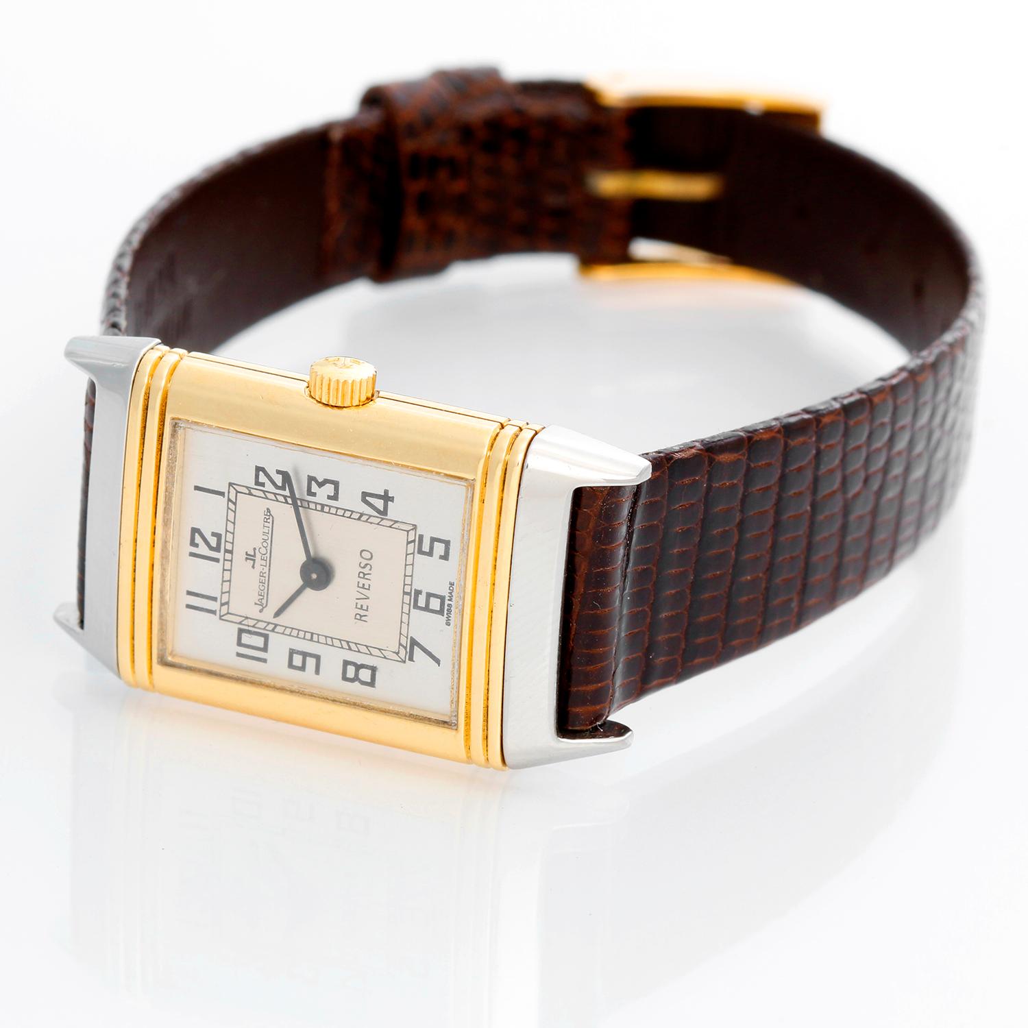 Jaeger-LeCoultre Reverso 2-Tone Ladies Watch 140.025.5 - Quartz. Stainless Steel and 18k yellow gold case reverses to solid high polished gold cover (19mm x 33mm). Silver dial with Arabic numerals . Black leather Jager Le-Coultre strap with Jager