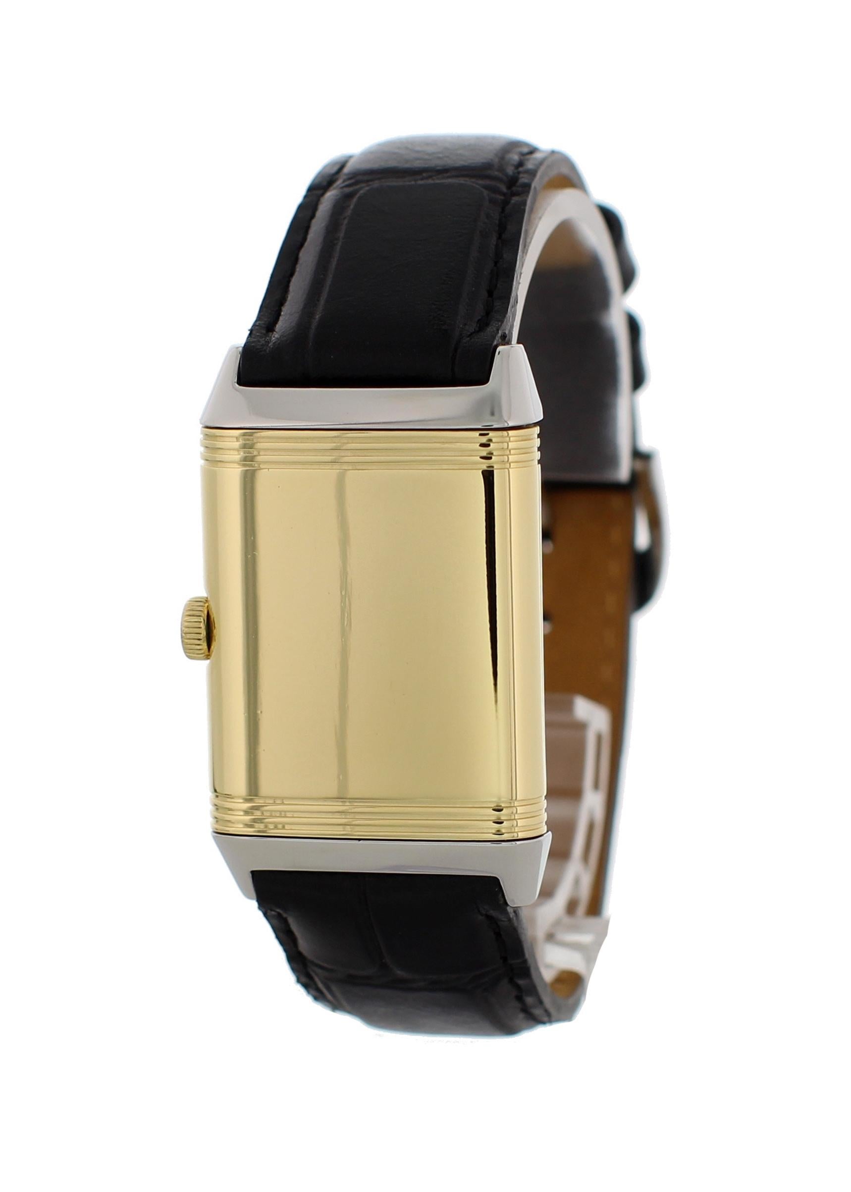 Jaeger-Le Coultre Reverso Classic Mens Watch. 26 mm stainless steel rectangular case with reeded ends rotating within its back plate.  Silver dial with blue steel hands and Arabic numeral hour markers. Minute markers around an inner ring. Black