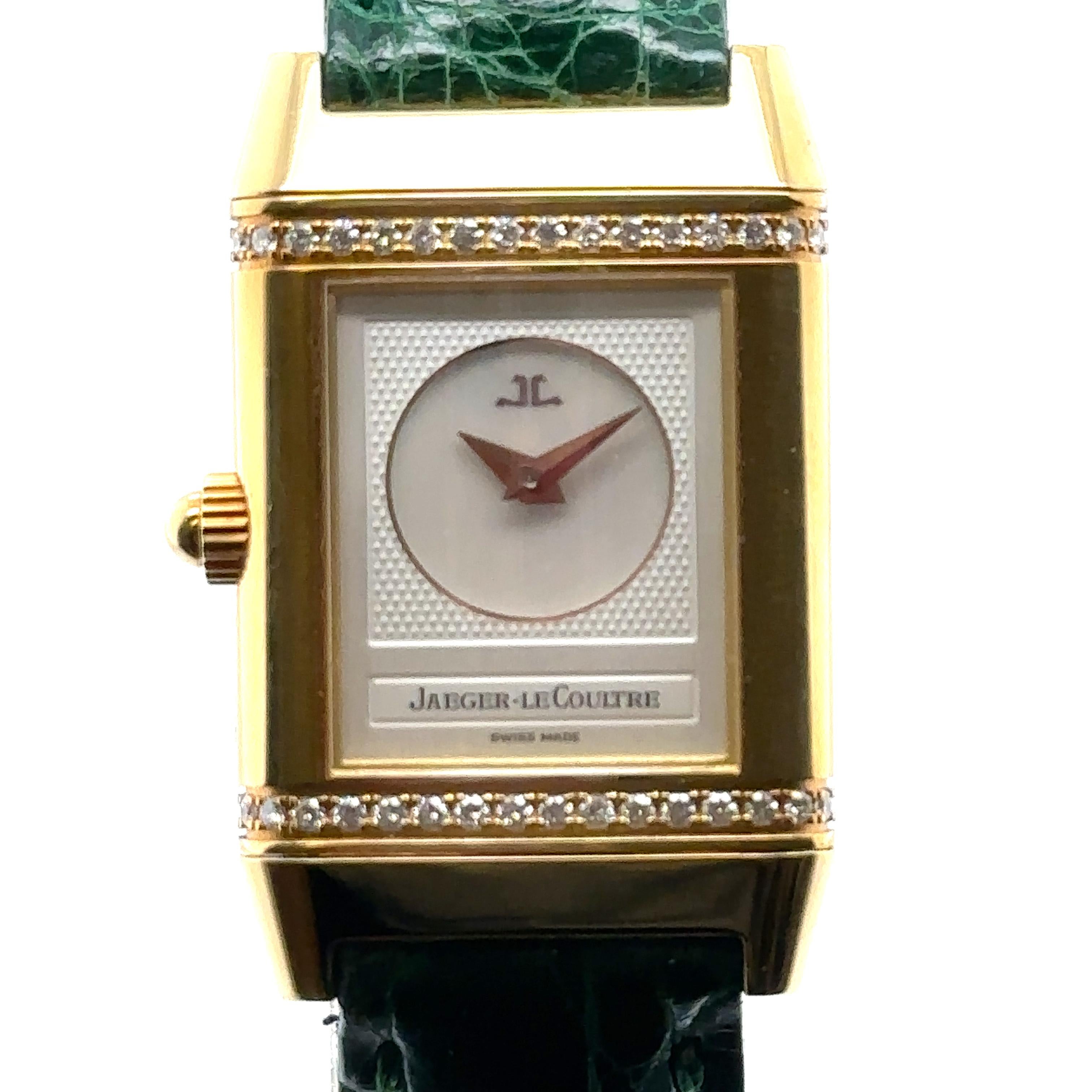 Jaeger Le-Coultre Reverso Ref 266.1.44
Yellow gold case and bezel.
Silver coloured front dial with black hands and arabic numerals.
Reverse dial is mother of pearl with gold coloured hands and case has row of diamonds top and bottom of case.
Manual
