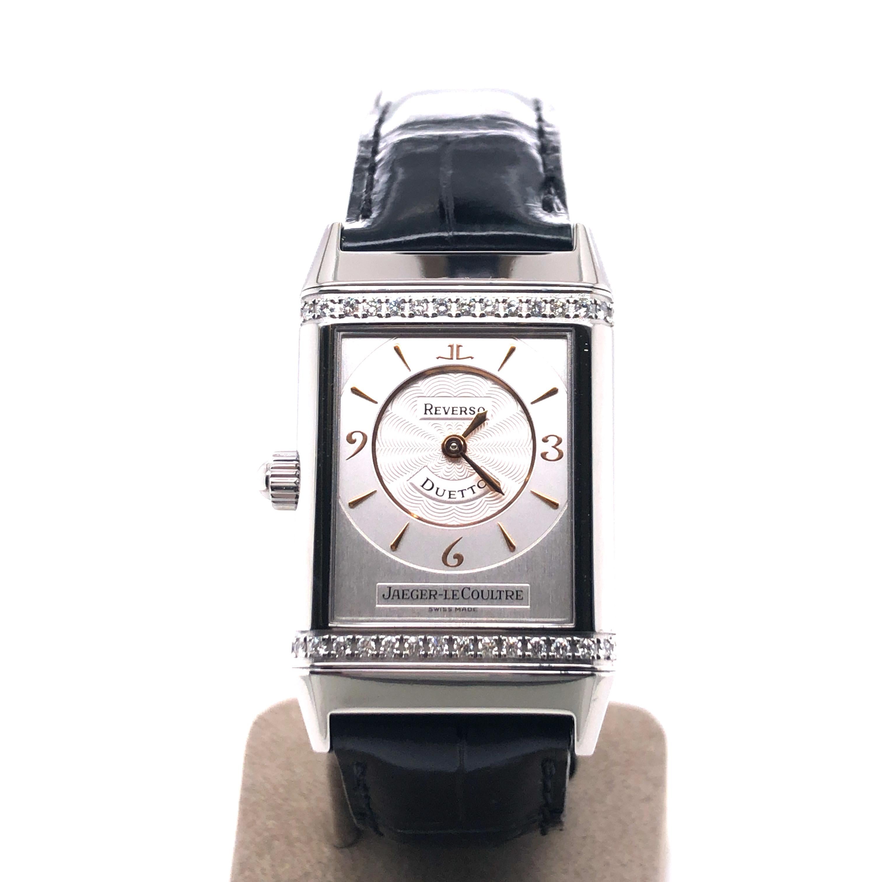 Super elegant Jaeger-LeCoultre Reverso-Duetto ladies watch ref. 256.875. Rectangular shaped case in stainless steel finished with new, black and original leather strap by JLC. The watch is secured with a double folding-clasp also in stainless steel.