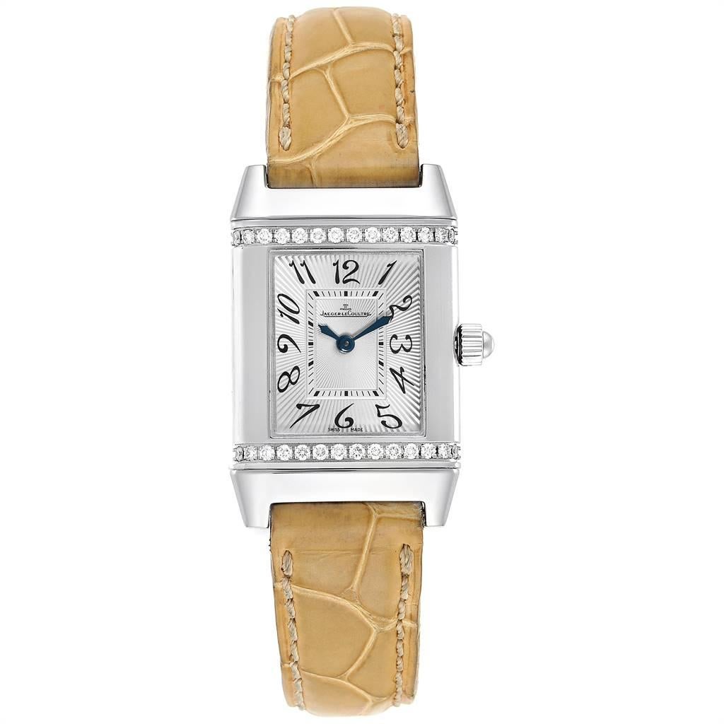 Jaeger-LeCoultre Reverso Florale Damen Diamantuhr 265.8.86 Q2658430. Quarzwerk. Rechteckiges Gehäuse aus Edelstahl 21,0 x 33,0 mm mit geriffelten Enden, drehbar in der Bodenplatte. Diamant-Lünette aus Edelstahl. Kratzfestes Saphirglas. Versilbertes