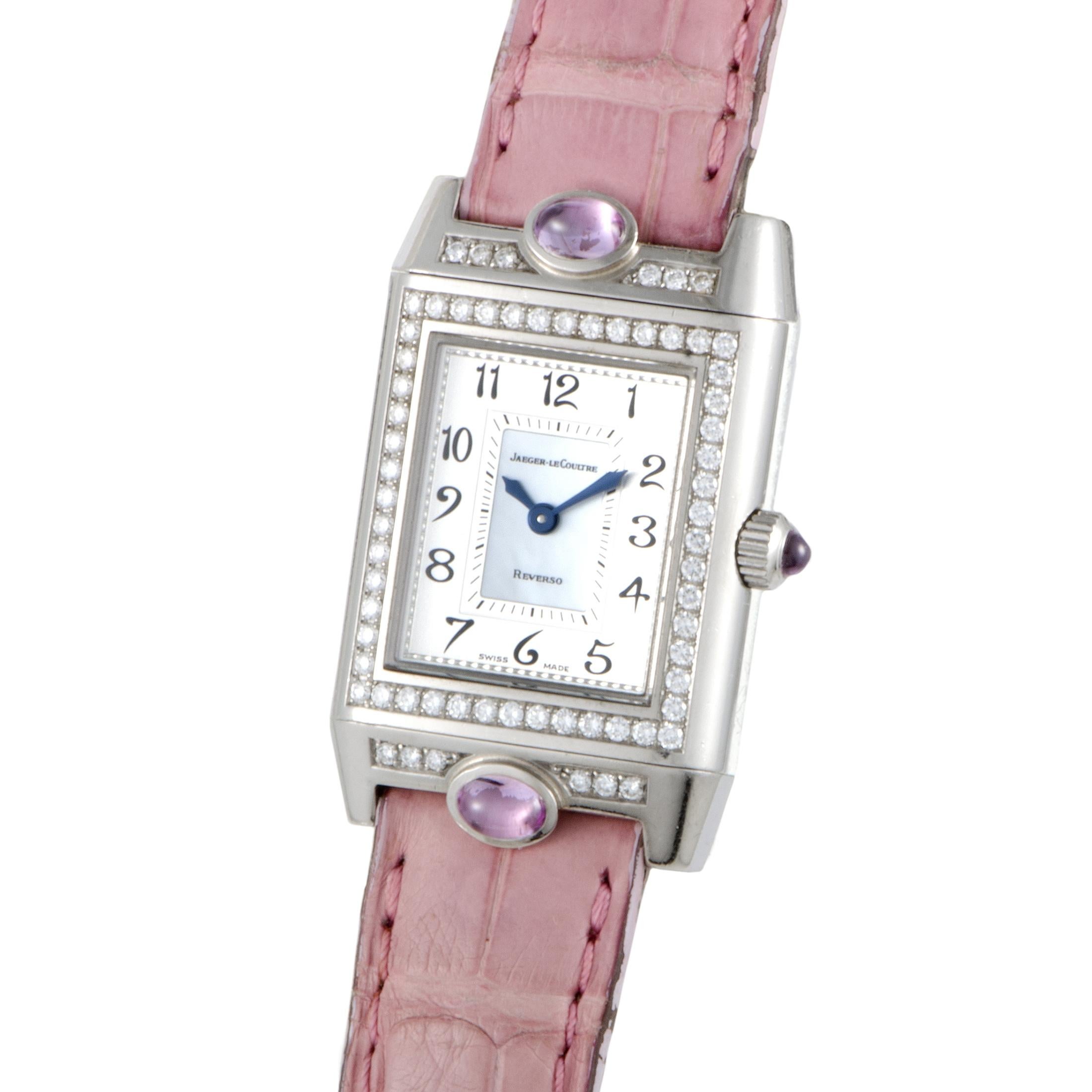 Jaeger LeCoultre Reverso Joaillerie Cabochons. 18K white gold case and a rectangular bezel made from the same metal and set with diamonds. Pink hand stitched leather strap with deployment buckle, silver dial with Black Arabic numerals, Three light