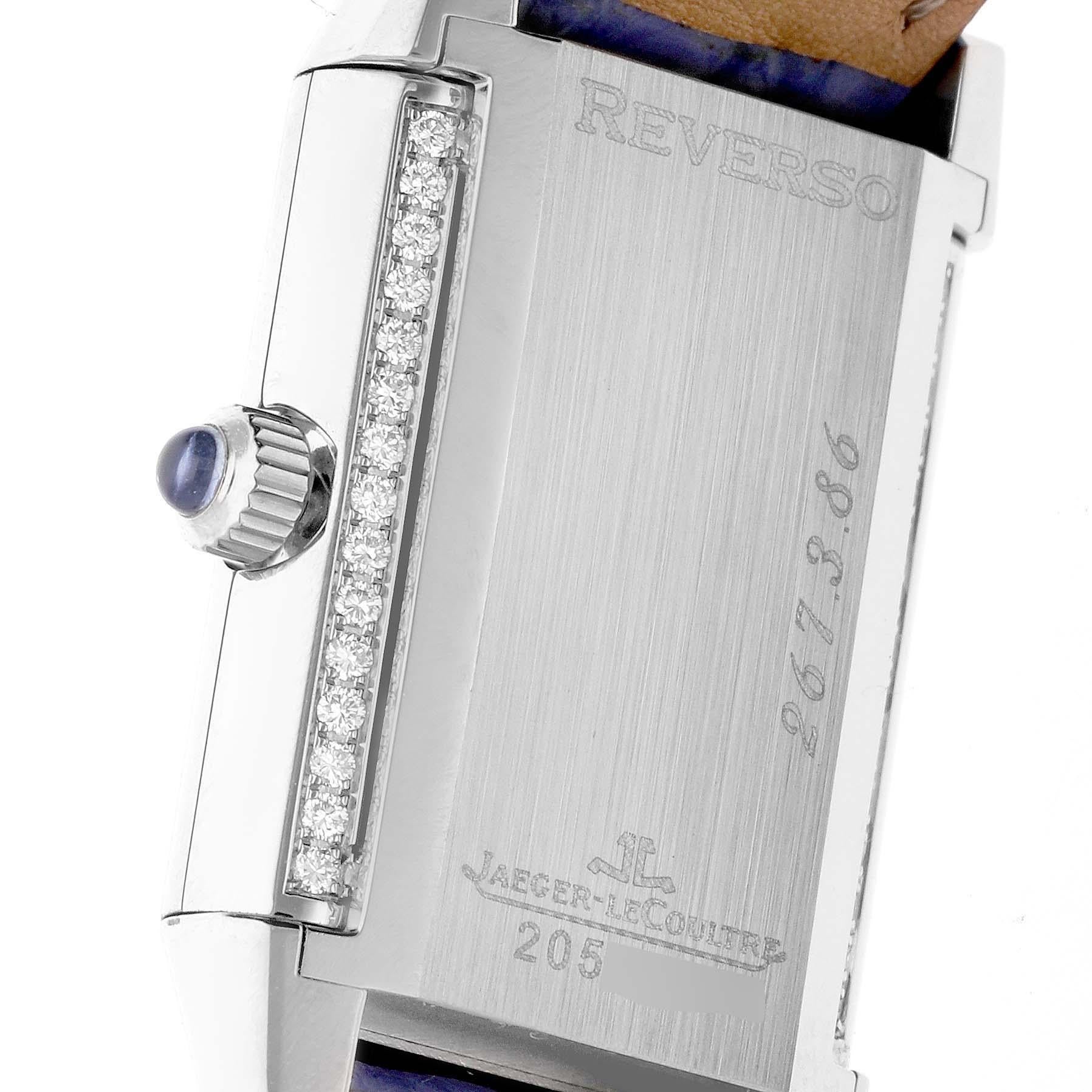 Jaeger LeCoultre Reverso Joaillerie White Gold Diamond Ladies Watch 267.3.86 Q2623403. Manual winding movement. 18K white gold 33 x 20 mm rectangular rotating case. Crown set with blue sapphire. Original JLC factory diamonds on case, bezel, and