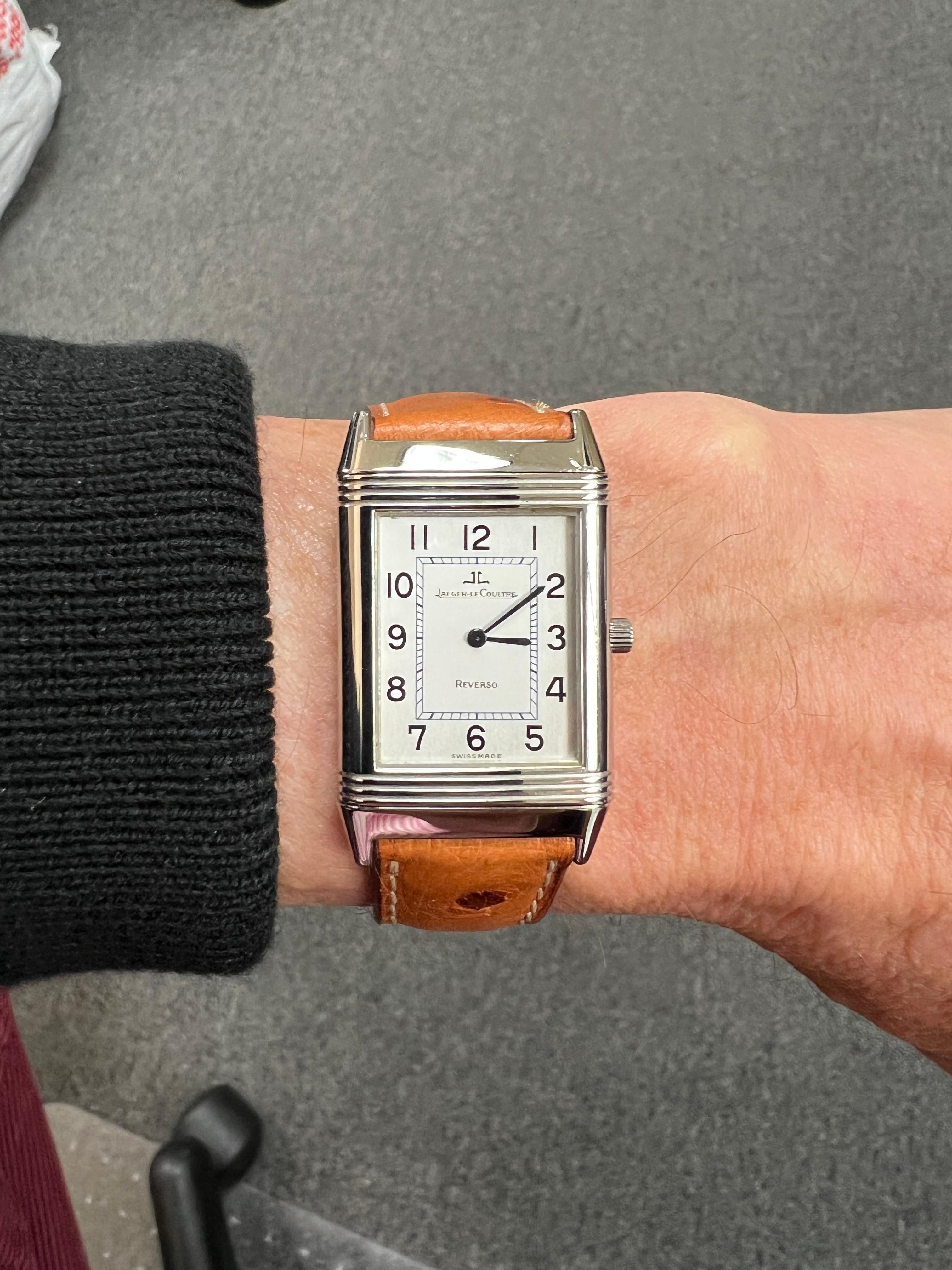 Jaeger Le Coultre Reverso Stainless Steel Quartz Wristwatch

The Jaeger LeCoultre Reverso with a Silver Dial and a light brown ostrich leather strap is a true classic.  The case is made of stainless steel with a silver dial and blue hands with