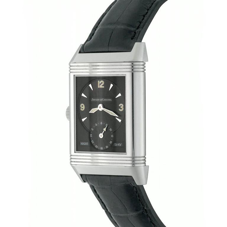Jaeger-LeCoultre Reverso Night & Day Model 270.8.54 Pre Owned Mens Wrist Watch. Silvered Dial with black Arabic numerals (shown). Dial Two: Gray Dial with polished hour markers & Arabic numerals with Night & Day Indicator.  Stainless Steel