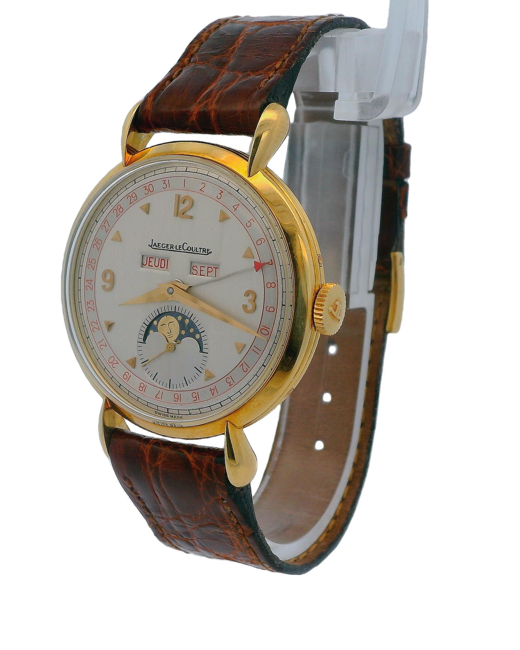 The Jaeger-LeCoultre wristwatch, made to commemorate the brand's 150th Anniversary, is a stunning 18K yellow gold triple calendar timepiece featuring a retrograde date and moon phase complications. With a classic 36mm diameter, the watch boasts a