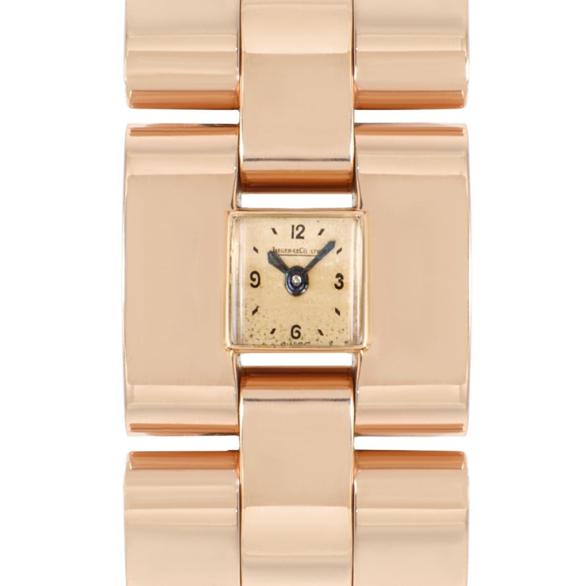 A vintage women's dress wristwatch, made from 18k rose gold, with a manual back winding movement.

A gorgeous 18k rose gold chunky bracelet is set with a little square champagne dial and secured with a concealed jewellery style clasp. The dial is