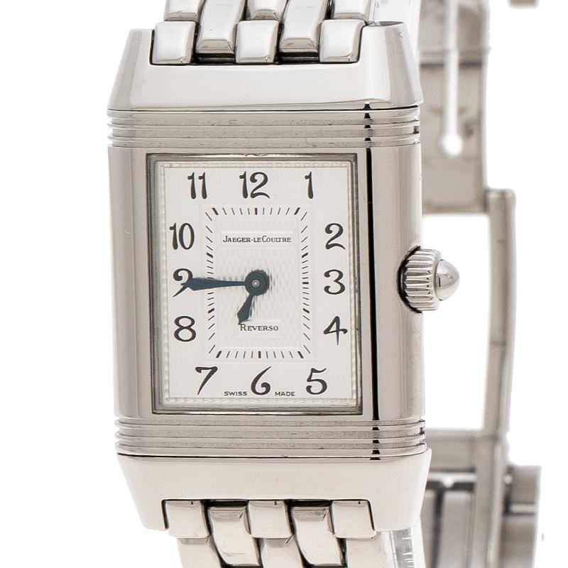 This Jaeger LeCoultre Reverso Classic Duetto watch is designed from a stunning white stainless steel body and features a case diameter of 20mm. It comes with a small, square mother of pearl dial detailed with Arabic numerals and sword-shaped hands